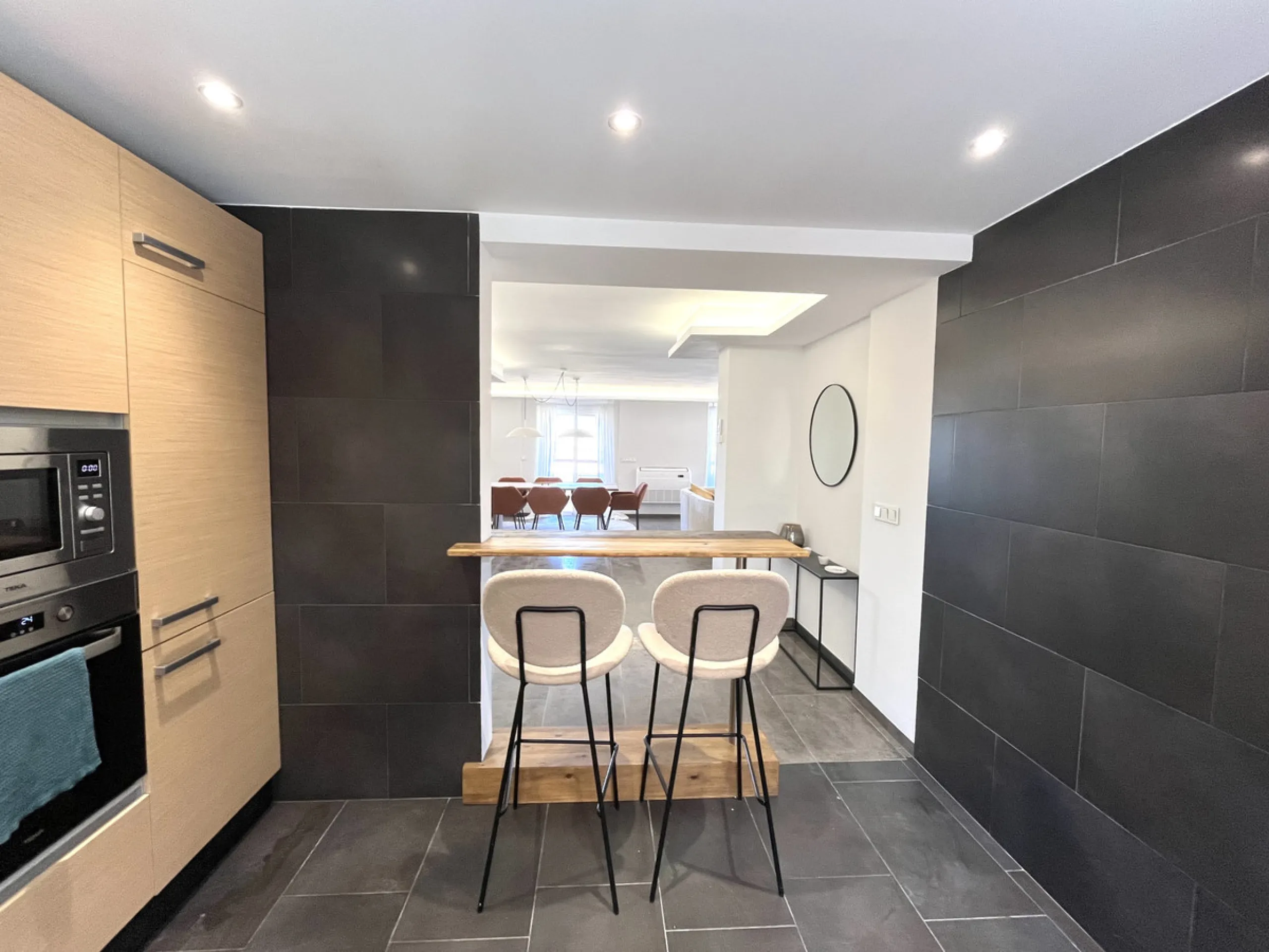 Experience the rare sense of space and openness in this beautifully renovated apartment, created by merging two separate units into one generous and well-designed home. This property offers panoramic views of the Mediterranean Sea and the surrounding moun