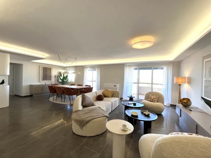 Experience the rare sense of space and openness in this beautifully renovated apartment, created by merging two separate units into one generous and well-designed home. This property offers panoramic views of the Mediterranean Sea and the surrounding moun