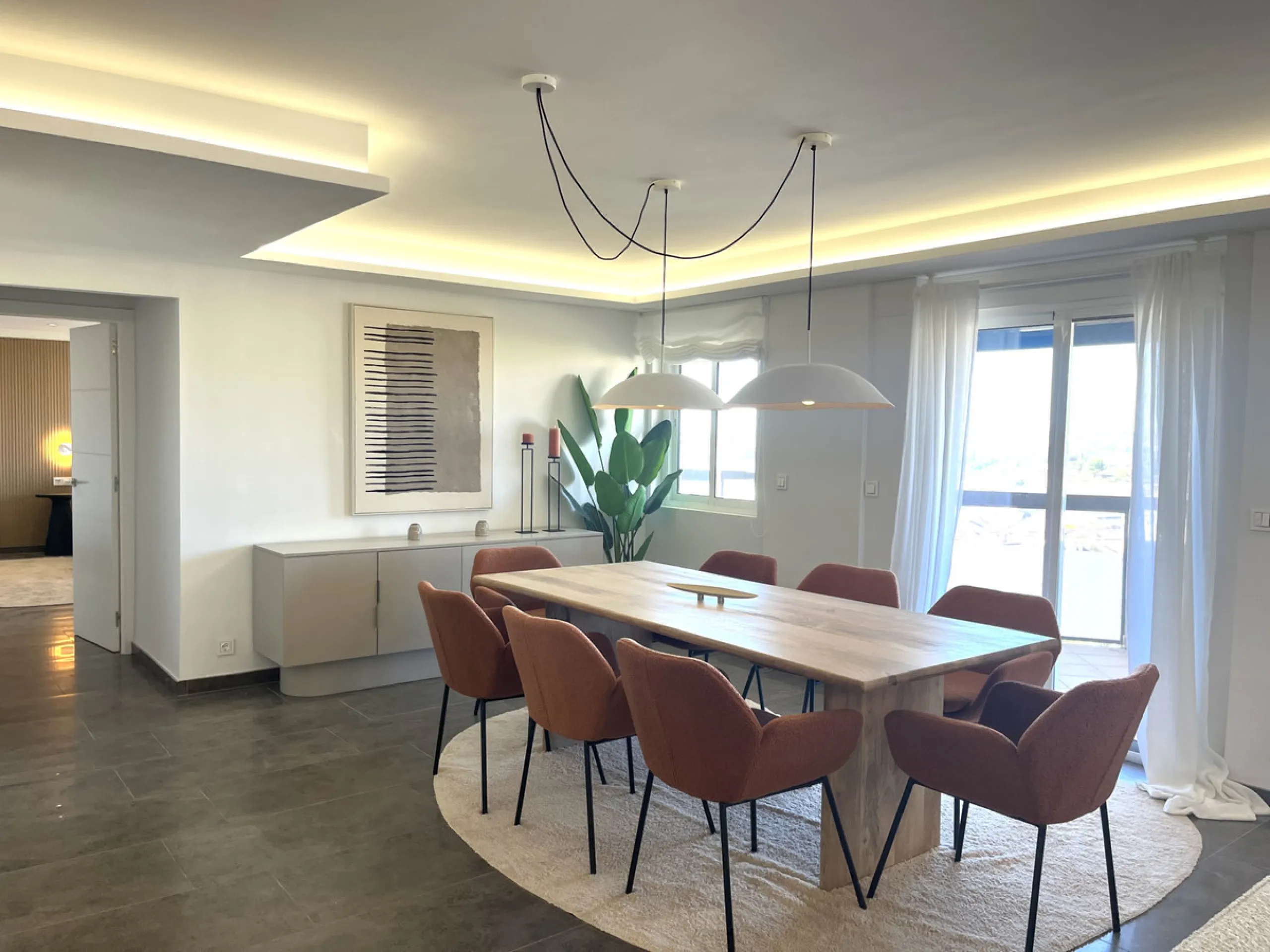 Experience the rare sense of space and openness in this beautifully renovated apartment, created by merging two separate units into one generous and well-designed home. This property offers panoramic views of the Mediterranean Sea and the surrounding moun