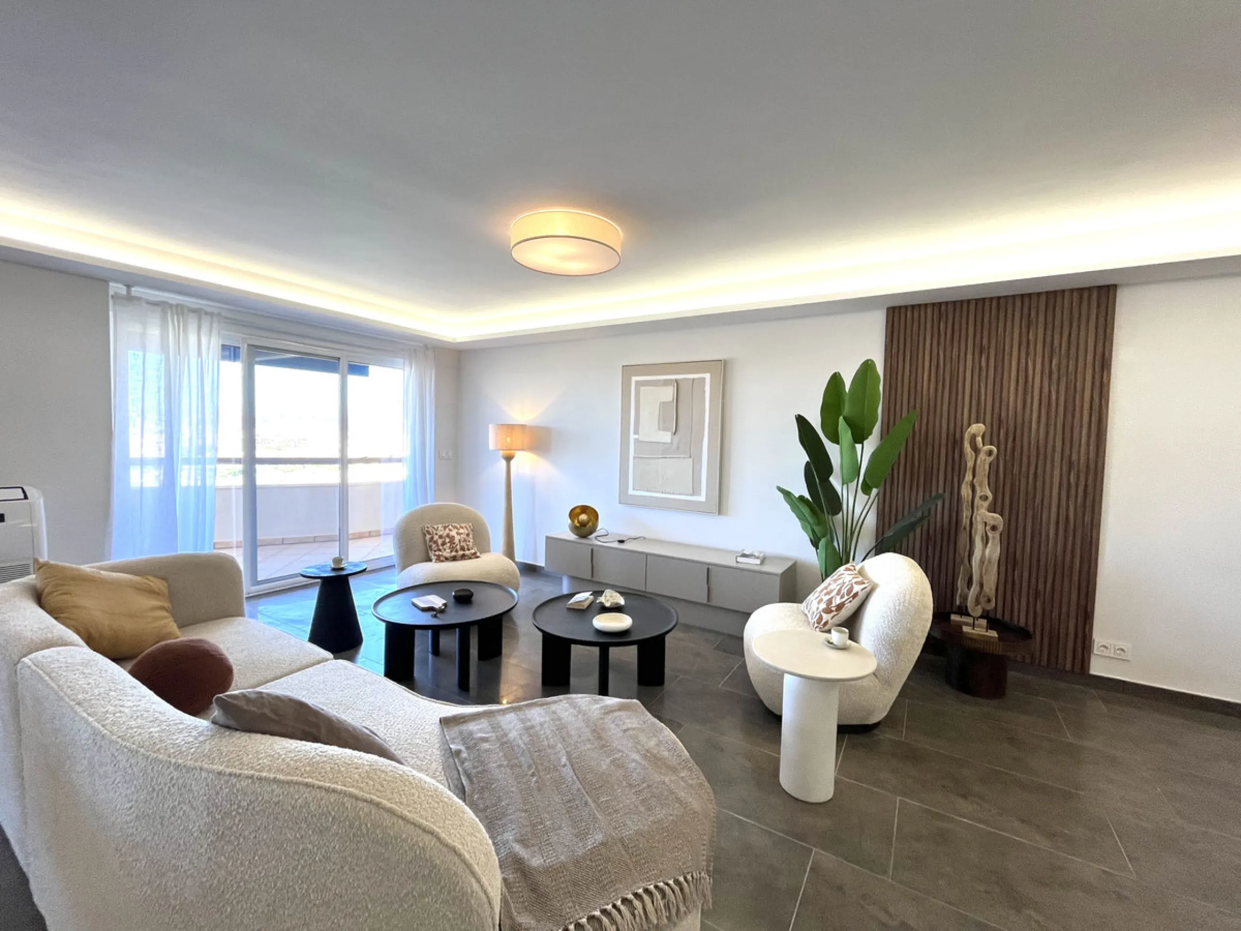 Experience the rare sense of space and openness in this beautifully renovated apartment, created by merging two separate units into one generous and well-designed home. This property offers panoramic views of the Mediterranean Sea and the surrounding moun