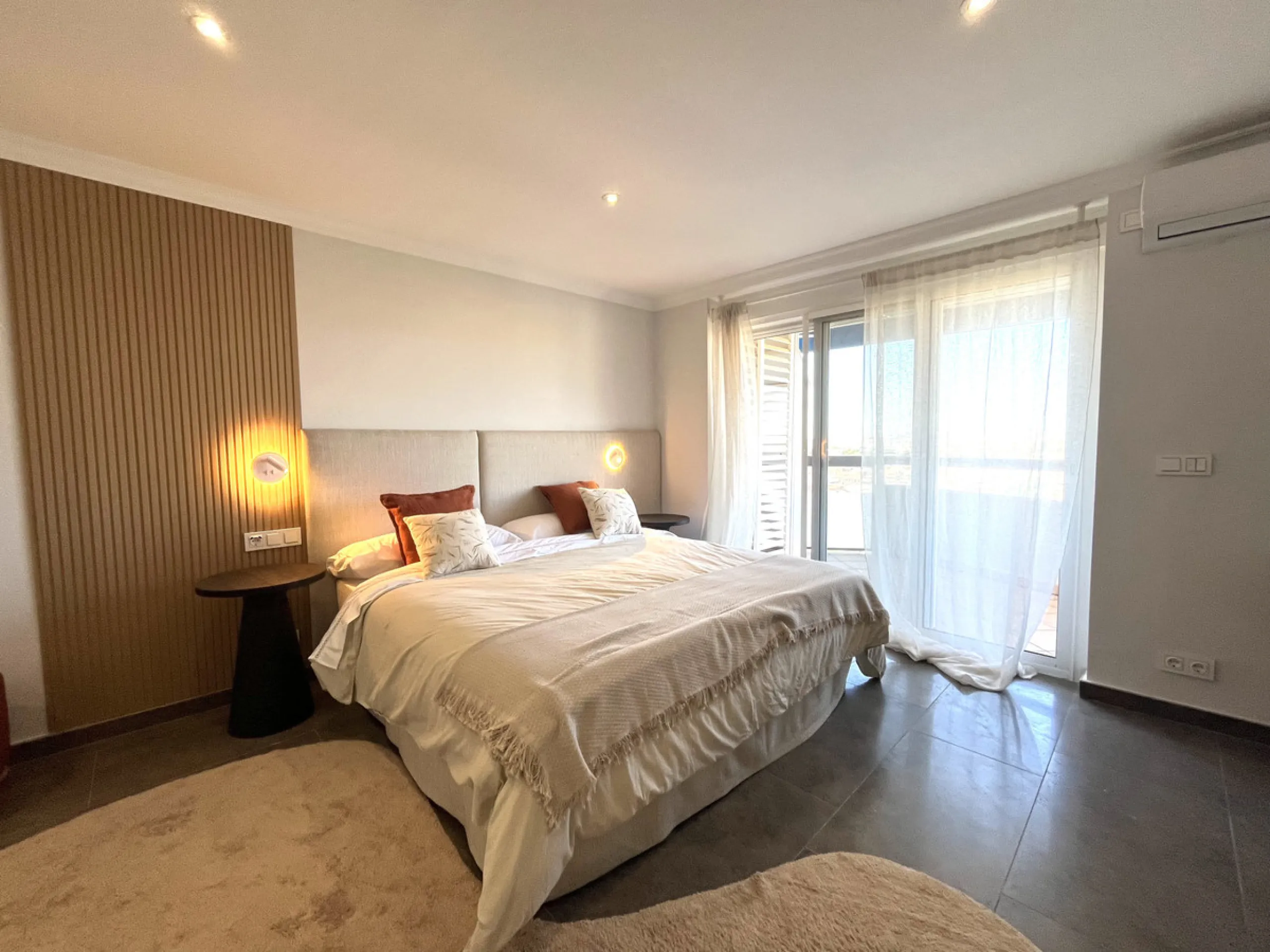Experience the rare sense of space and openness in this beautifully renovated apartment, created by merging two separate units into one generous and well-designed home. This property offers panoramic views of the Mediterranean Sea and the surrounding moun