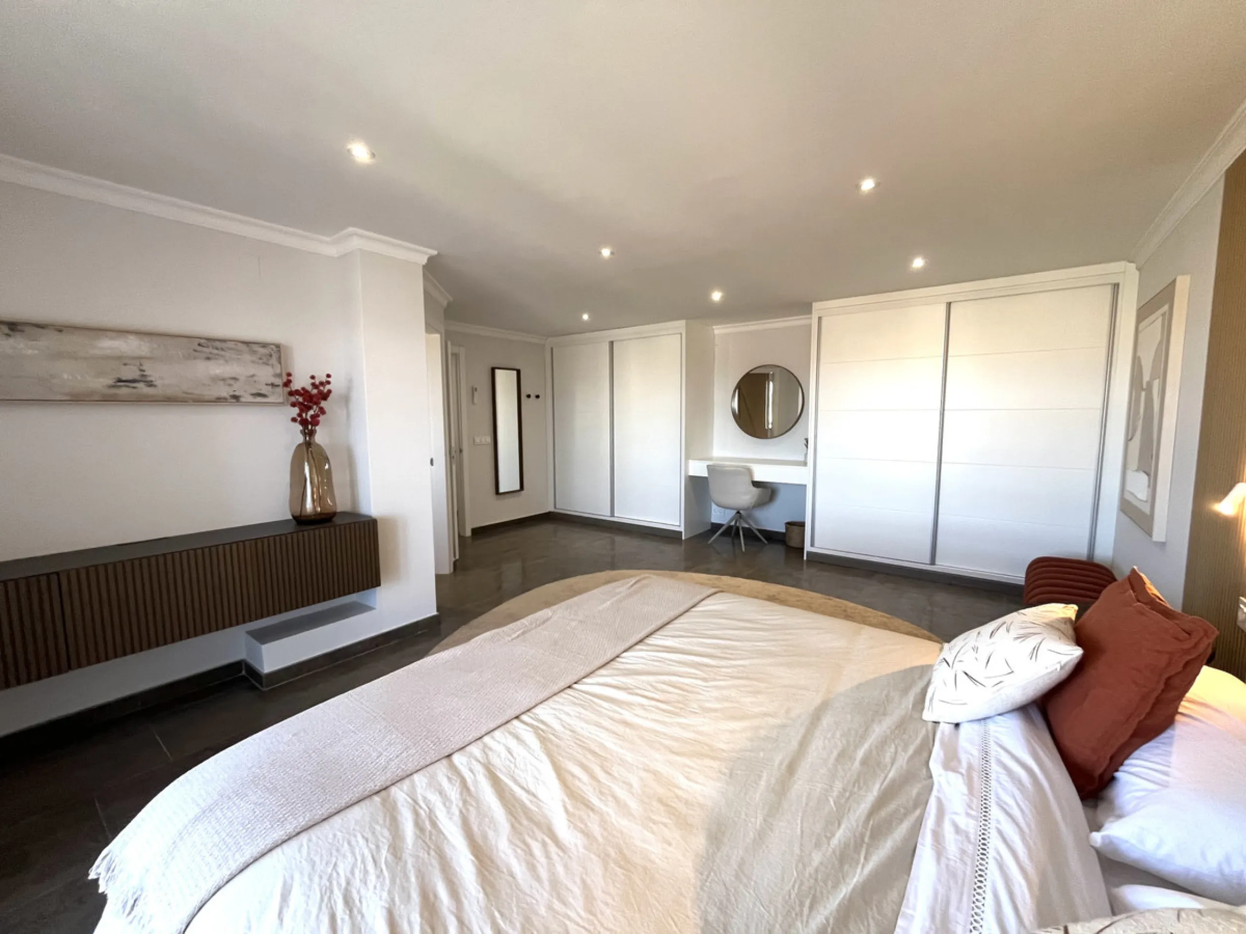 Experience the rare sense of space and openness in this beautifully renovated apartment, created by merging two separate units into one generous and well-designed home. This property offers panoramic views of the Mediterranean Sea and the surrounding moun