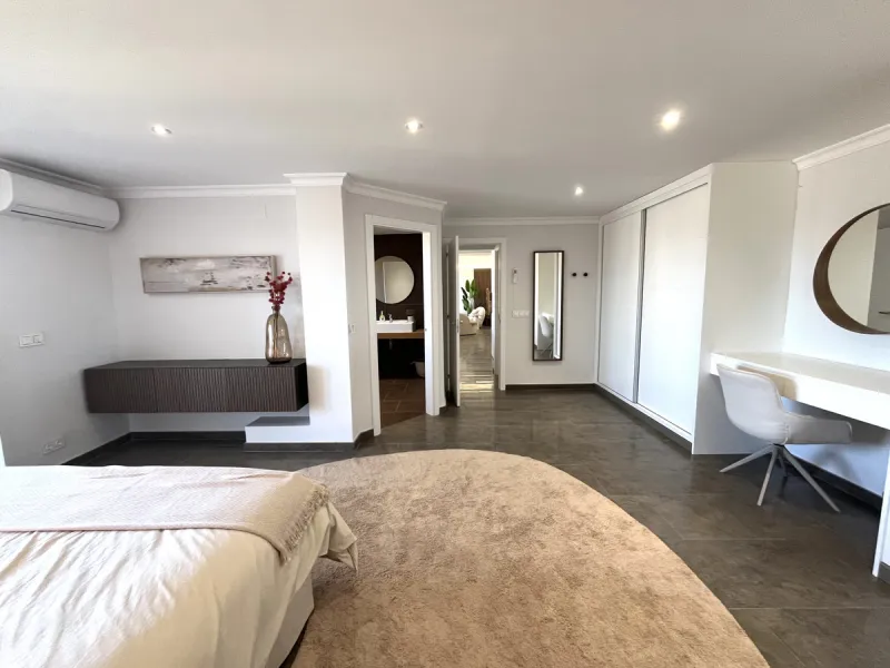Experience the rare sense of space and openness in this beautifully renovated apartment, created by merging two separate units into one generous and well-designed home. This property offers panoramic views of the Mediterranean Sea and the surrounding moun