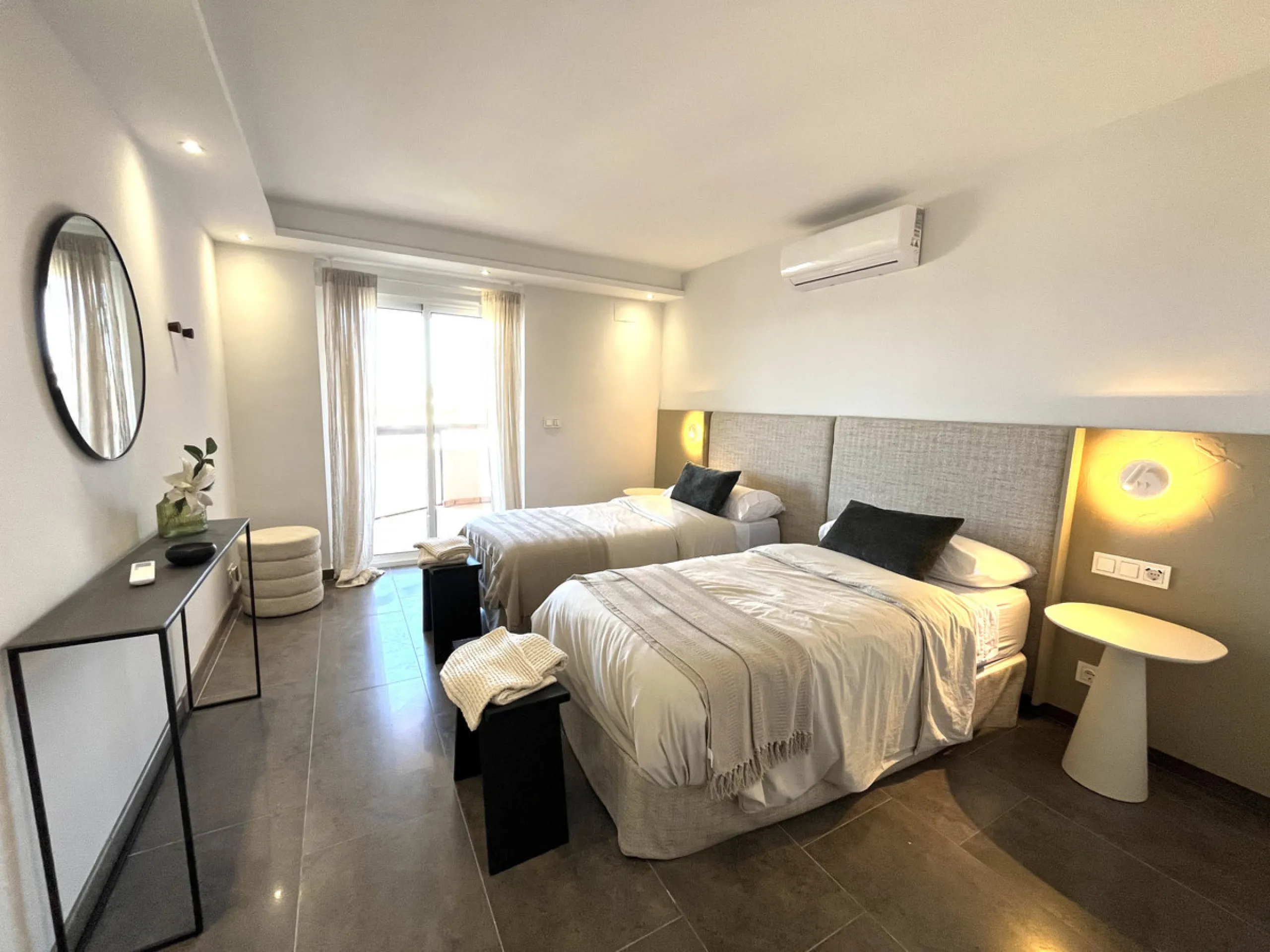 Experience the rare sense of space and openness in this beautifully renovated apartment, created by merging two separate units into one generous and well-designed home. This property offers panoramic views of the Mediterranean Sea and the surrounding moun