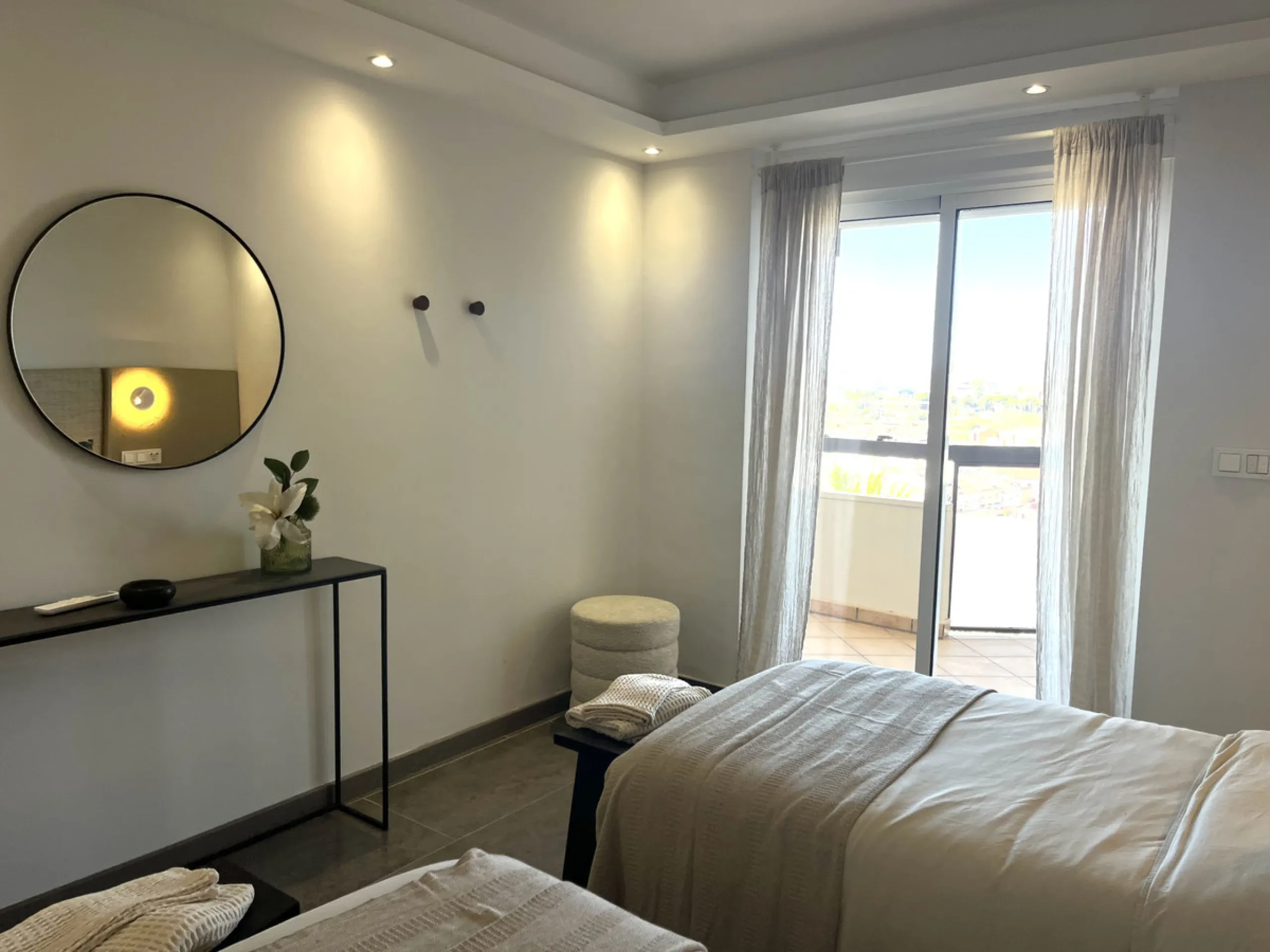 Experience the rare sense of space and openness in this beautifully renovated apartment, created by merging two separate units into one generous and well-designed home. This property offers panoramic views of the Mediterranean Sea and the surrounding moun