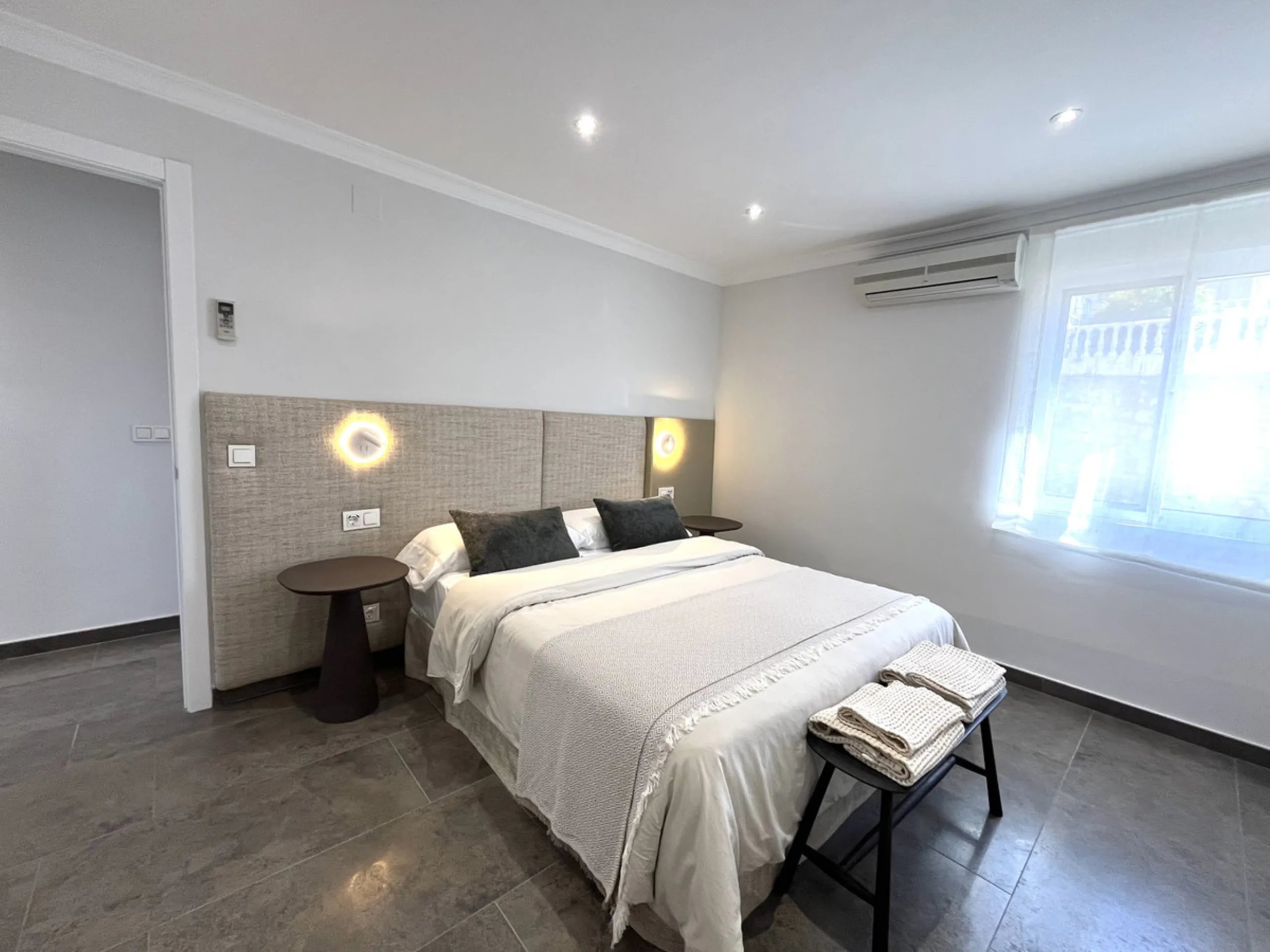 Experience the rare sense of space and openness in this beautifully renovated apartment, created by merging two separate units into one generous and well-designed home. This property offers panoramic views of the Mediterranean Sea and the surrounding moun