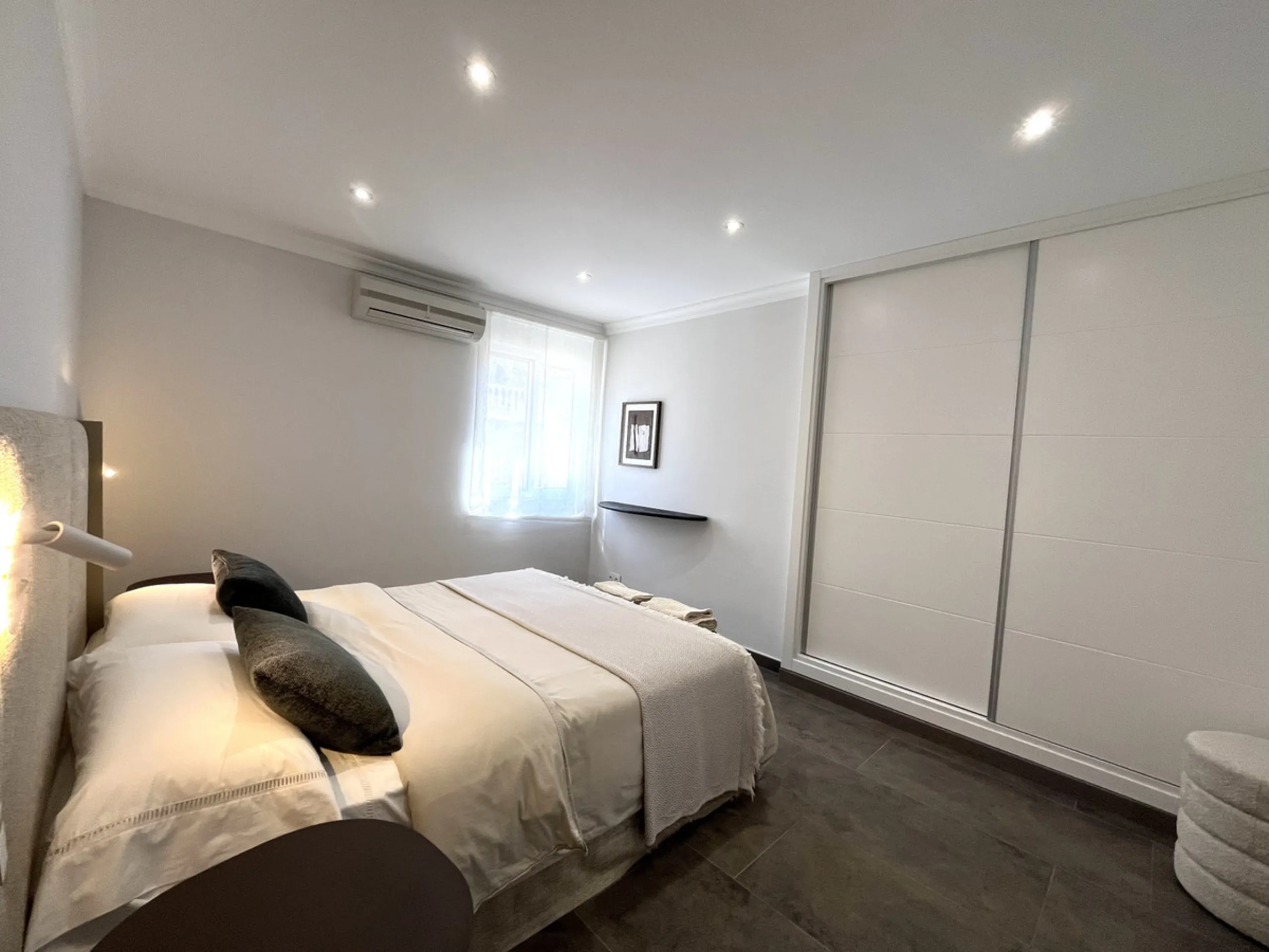 Experience the rare sense of space and openness in this beautifully renovated apartment, created by merging two separate units into one generous and well-designed home. This property offers panoramic views of the Mediterranean Sea and the surrounding moun