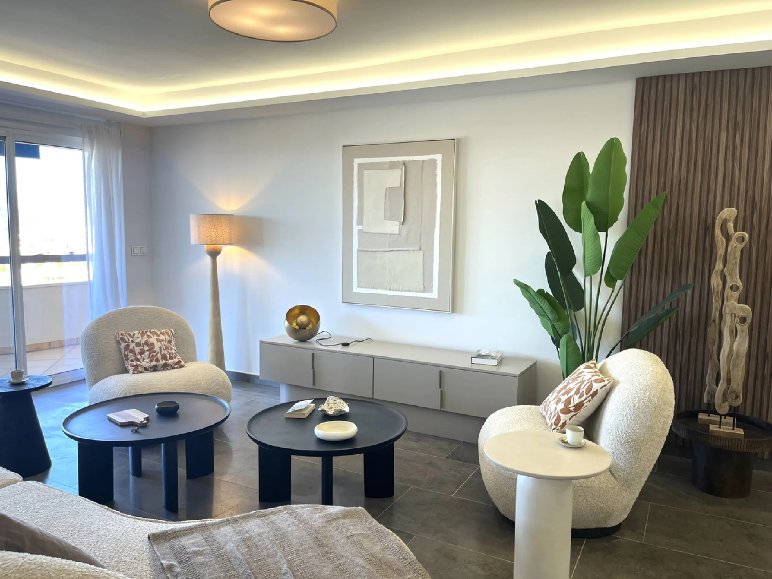Experience the rare sense of space and openness in this beautifully renovated apartment, created by merging two separate units into one generous and well-designed home. This property offers panoramic views of the Mediterranean Sea and the surrounding moun