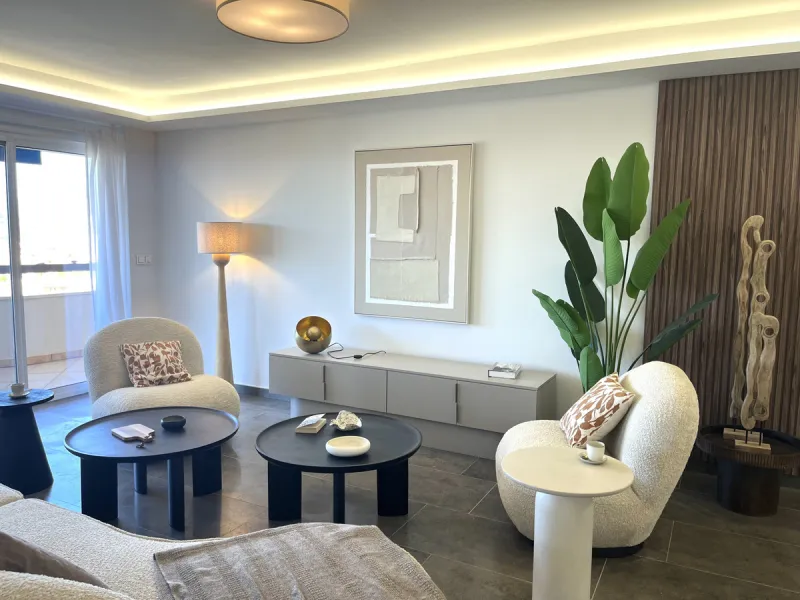 Experience the rare sense of space and openness in this beautifully renovated apartment, created by merging two separate units into one generous and well-designed home. This property offers panoramic views of the Mediterranean Sea and the surrounding moun