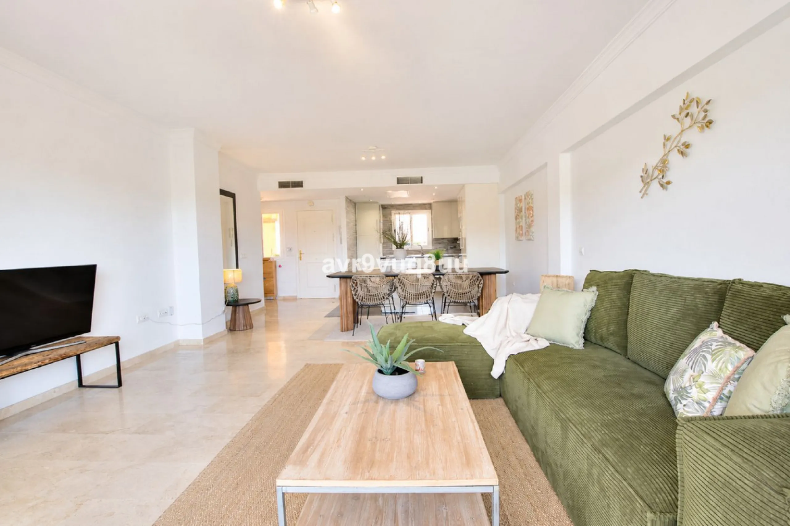 A very comfortable home located in the well established urbanisation of Mijas Golf. This spacious house has bright spacious rooms throughout including, on the top floor, a brand new open plan kitchen, lovely lounge diner with fireplace plus a large bedroo