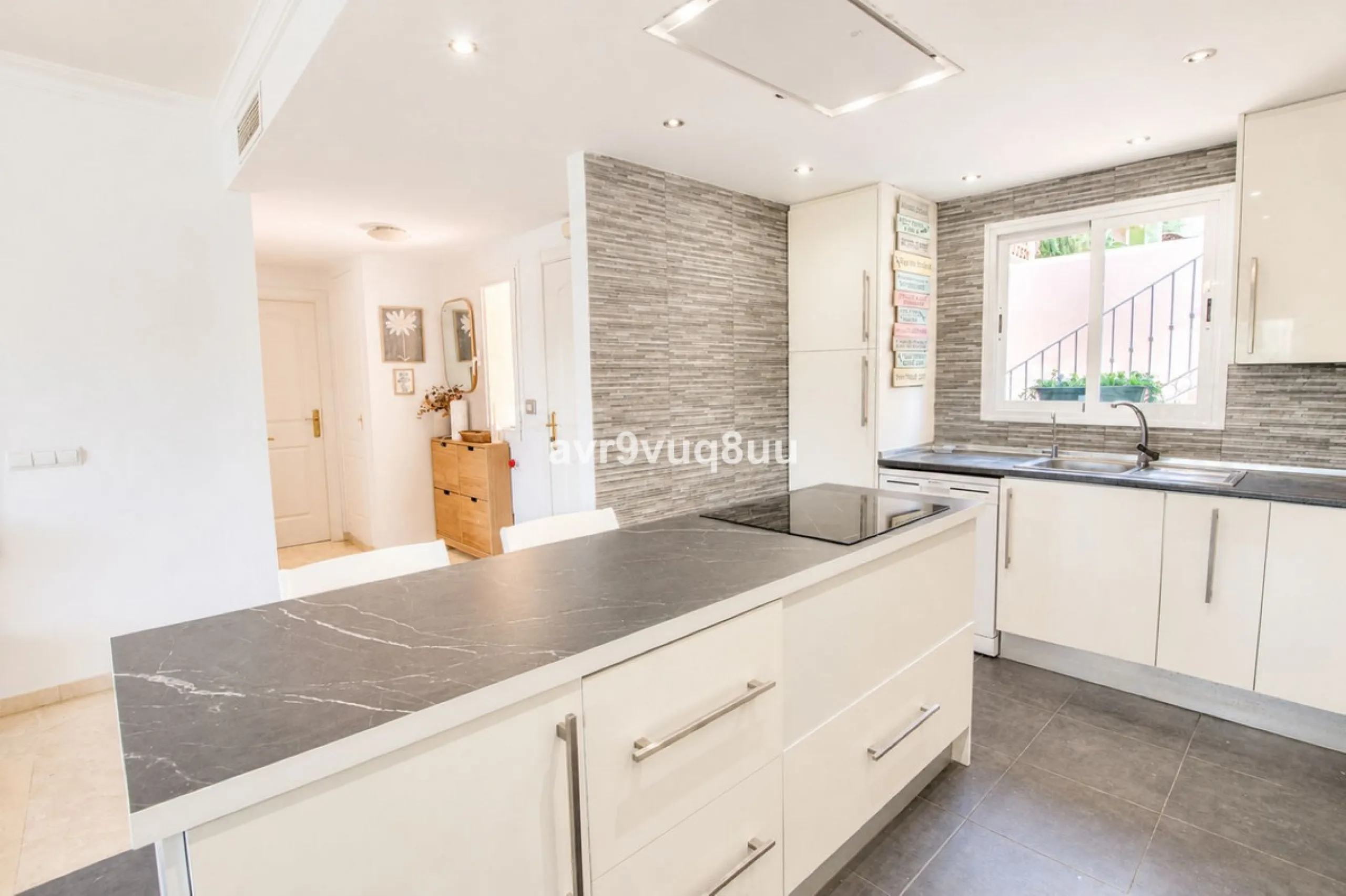 A very comfortable home located in the well established urbanisation of Mijas Golf. This spacious house has bright spacious rooms throughout including, on the top floor, a brand new open plan kitchen, lovely lounge diner with fireplace plus a large bedroo