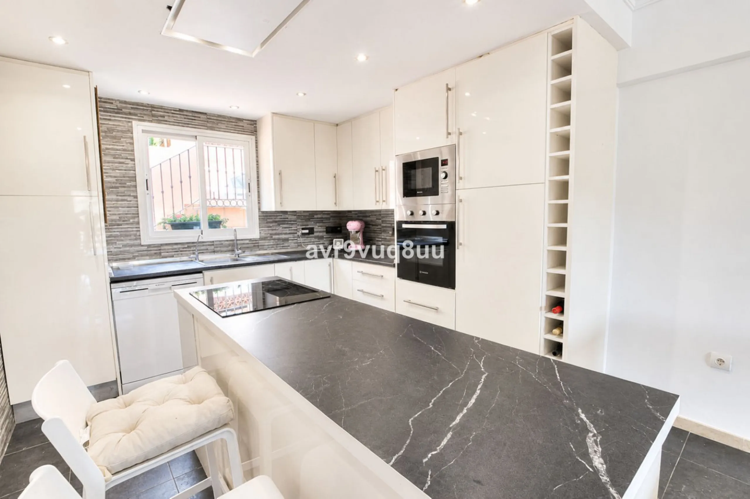 A very comfortable home located in the well established urbanisation of Mijas Golf. This spacious house has bright spacious rooms throughout including, on the top floor, a brand new open plan kitchen, lovely lounge diner with fireplace plus a large bedroo