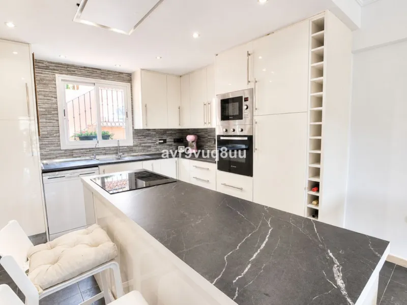 A very comfortable home located in the well established urbanisation of Mijas Golf. This spacious house has bright spacious rooms throughout including, on the top floor, a brand new open plan kitchen, lovely lounge diner with fireplace plus a large bedroo