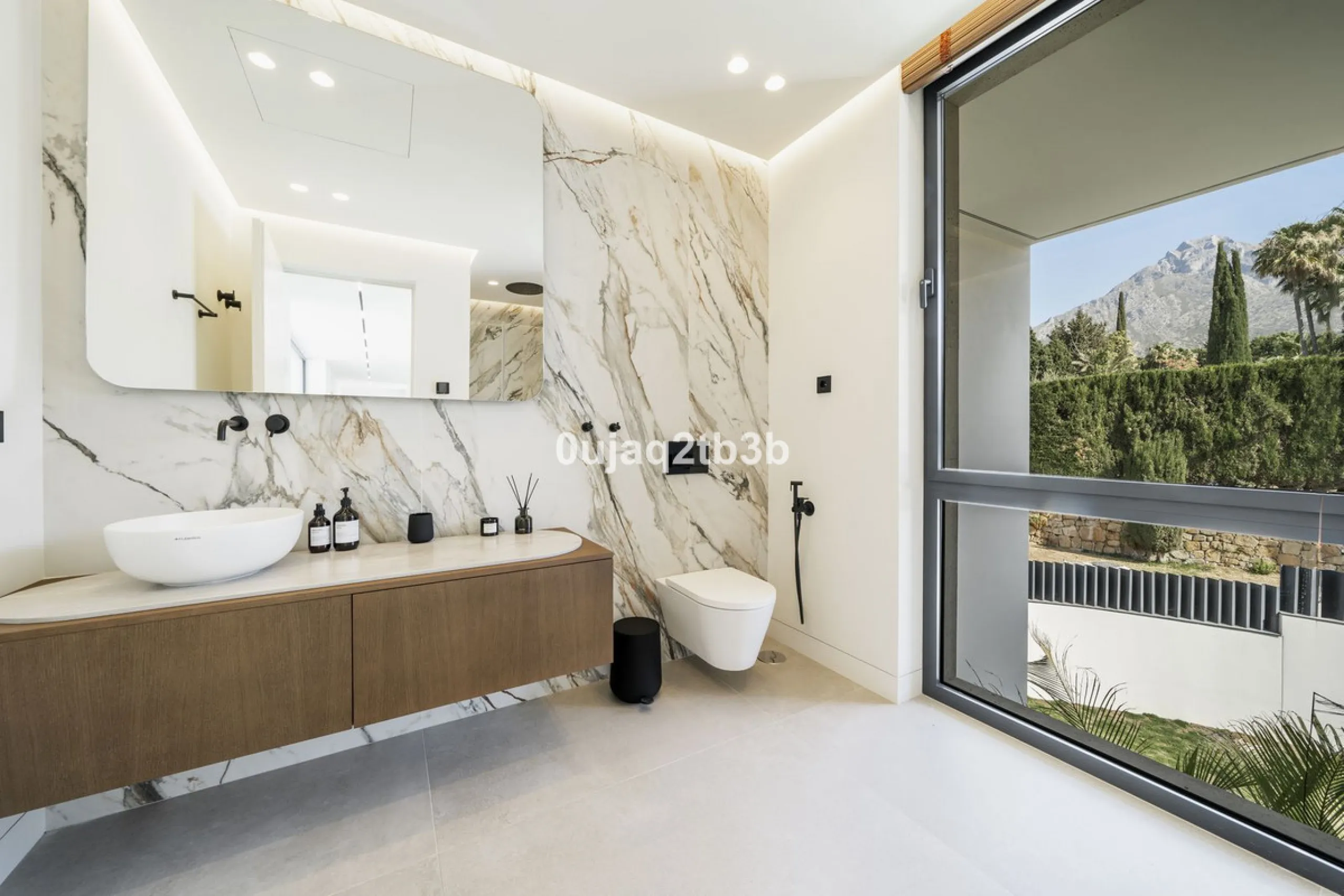 Stunning brand new villa in the best location in Marbella. Perfectly communicated to the main roads that drive you to the airport, Puerto Banús and just a few minutes away from Marbella's center. This state-of-the-art new villa occupies a 1.050m2 plot pos
