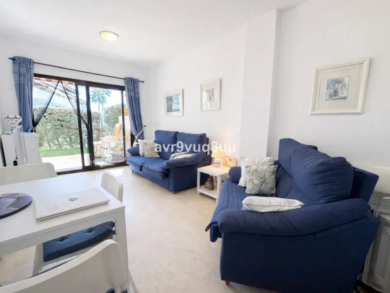 Ground floor apartment in a well established complex in the heart of Riviera del Sol. Large bright lounge diner with access to the closed sunny terrace and large private garden.  Views over the communal gardens and paddle courts. Ample bedrooms with built
