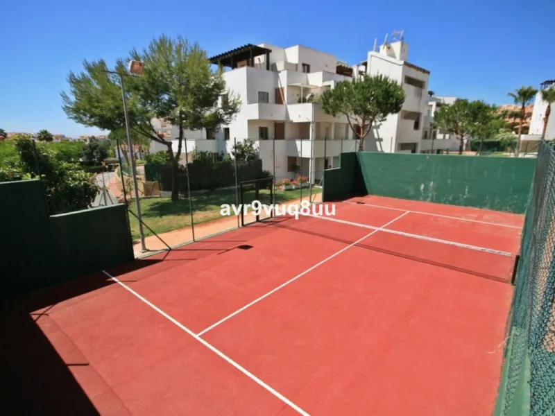 Ground floor apartment in a well established complex in the heart of Riviera del Sol. Large bright lounge diner with access to the closed sunny terrace and large private garden.  Views over the communal gardens and paddle courts. Ample bedrooms with built
