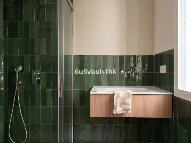 On the ground floor of a charming building, this unique property welcomes you through a picturesque Andalusian patio, with traditional Spanish tiles and a tranquil fountain.