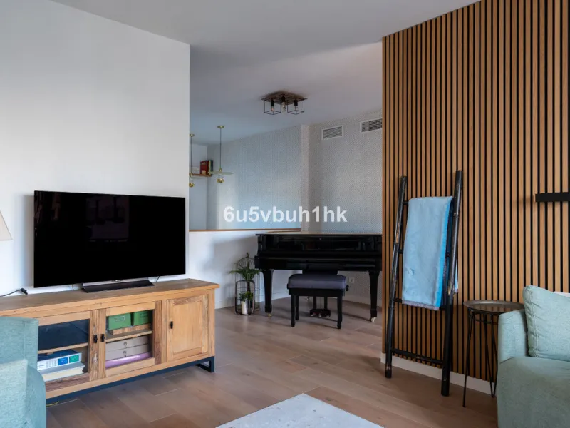 Discover a rare opportunity to own two beautifully designed homes combined on one generous plot in the heart of Vélez-Málaga — complete with private parking, a swimming pool, extensive entertainment areas, and a substantial commercial premise generating €