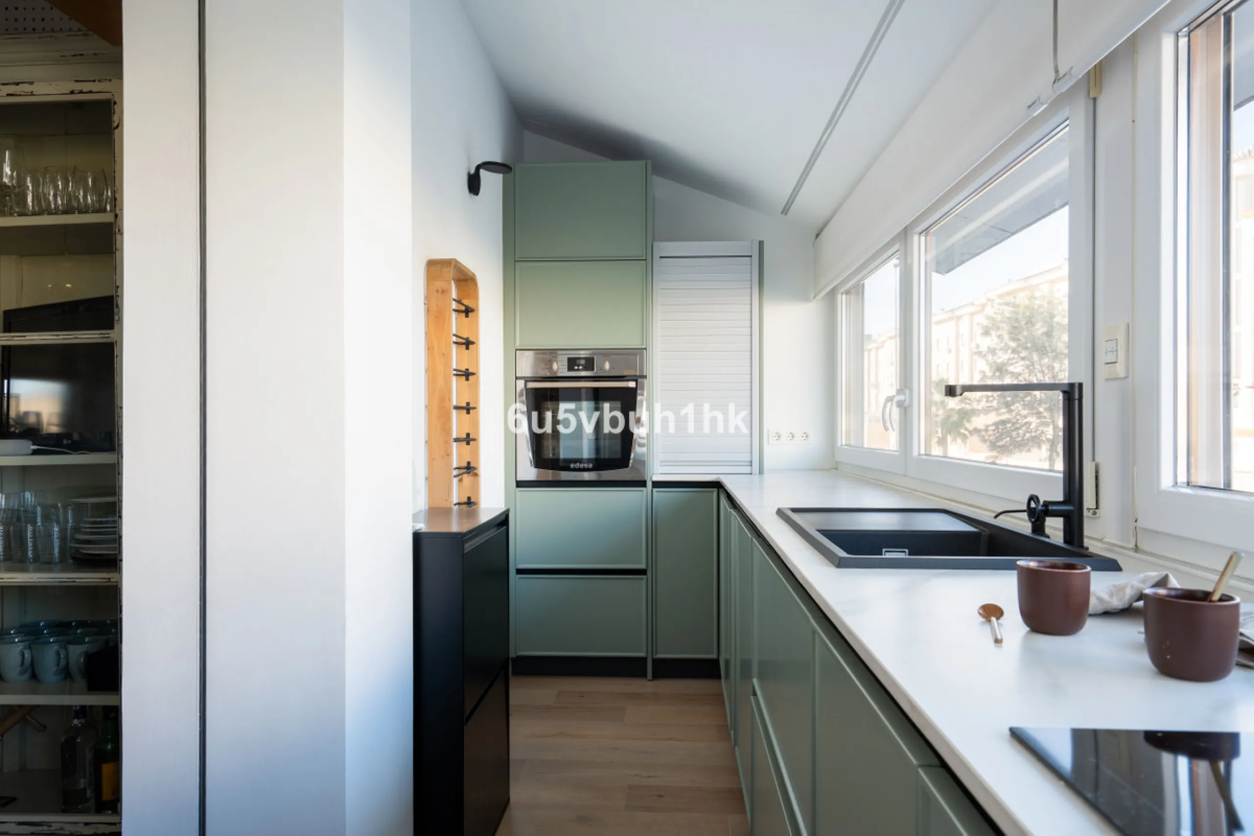 Discover a rare opportunity to own two beautifully designed homes combined on one generous plot in the heart of Vélez-Málaga — complete with private parking, a swimming pool, extensive entertainment areas, and a substantial commercial premise generating €