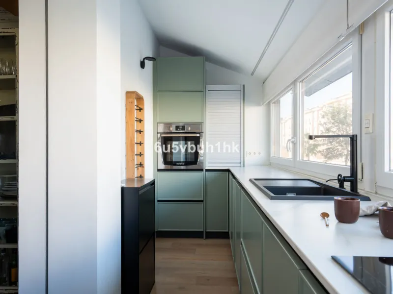 Discover a rare opportunity to own two beautifully designed homes combined on one generous plot in the heart of Vélez-Málaga — complete with private parking, a swimming pool, extensive entertainment areas, and a substantial commercial premise generating €