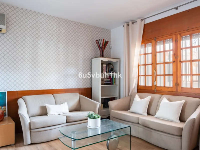 Discover a rare opportunity to own two beautifully designed homes combined on one generous plot in the heart of Vélez-Málaga — complete with private parking, a swimming pool, extensive entertainment areas, and a substantial commercial premise generating €