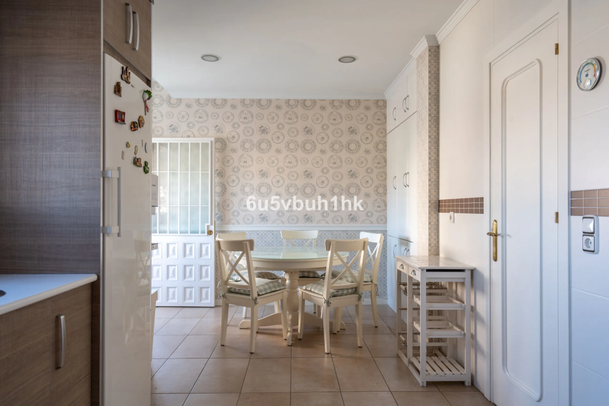 Discover a rare opportunity to own two beautifully designed homes combined on one generous plot in the heart of Vélez-Málaga — complete with private parking, a swimming pool, extensive entertainment areas, and a substantial commercial premise generating €
