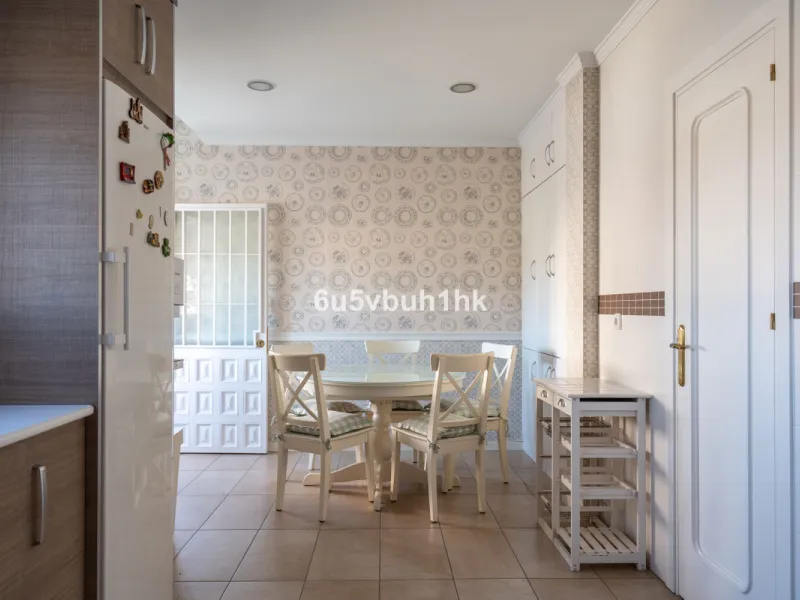Discover a rare opportunity to own two beautifully designed homes combined on one generous plot in the heart of Vélez-Málaga — complete with private parking, a swimming pool, extensive entertainment areas, and a substantial commercial premise generating €
