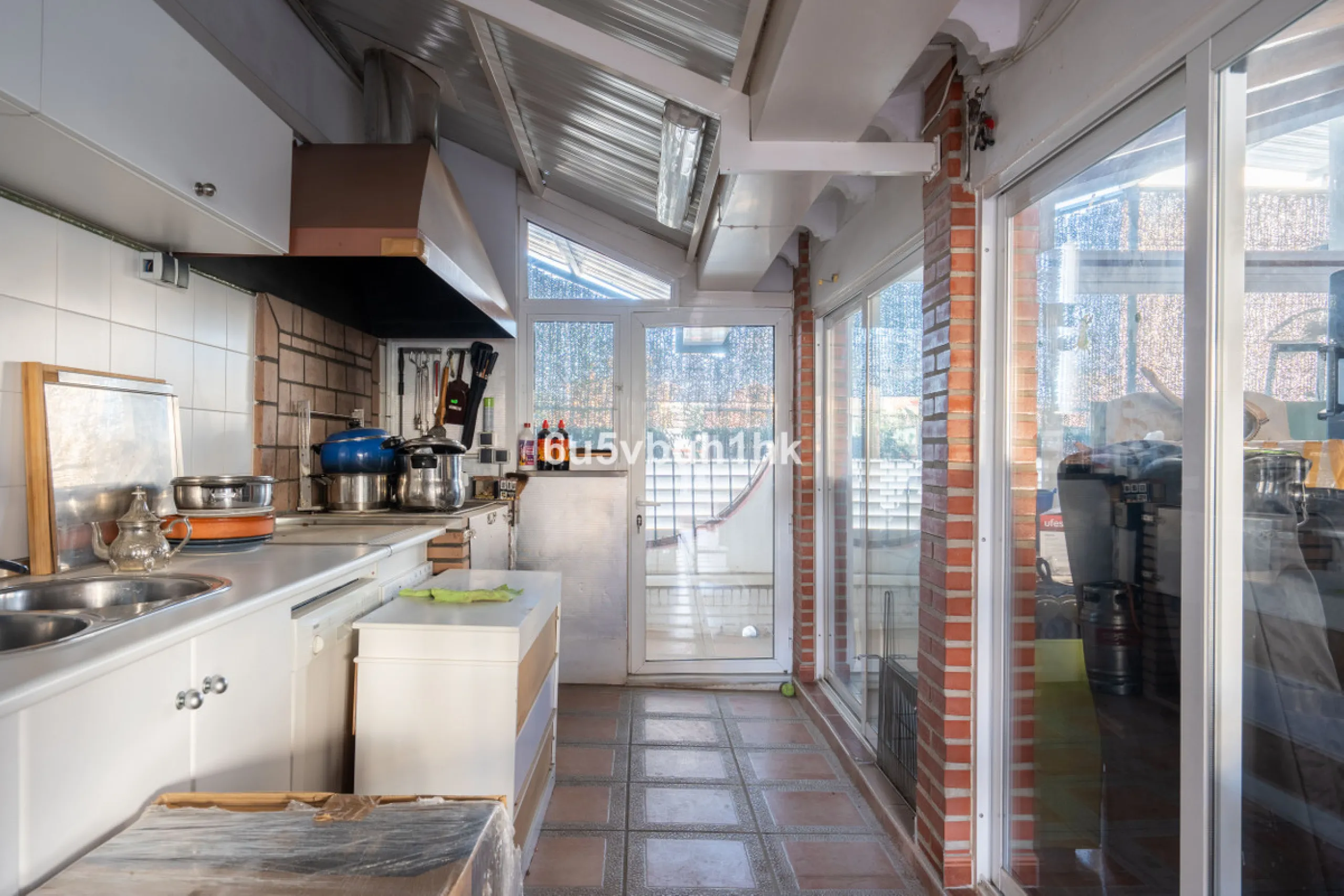 Discover a rare opportunity to own two beautifully designed homes combined on one generous plot in the heart of Vélez-Málaga — complete with private parking, a swimming pool, extensive entertainment areas, and a substantial commercial premise generating €