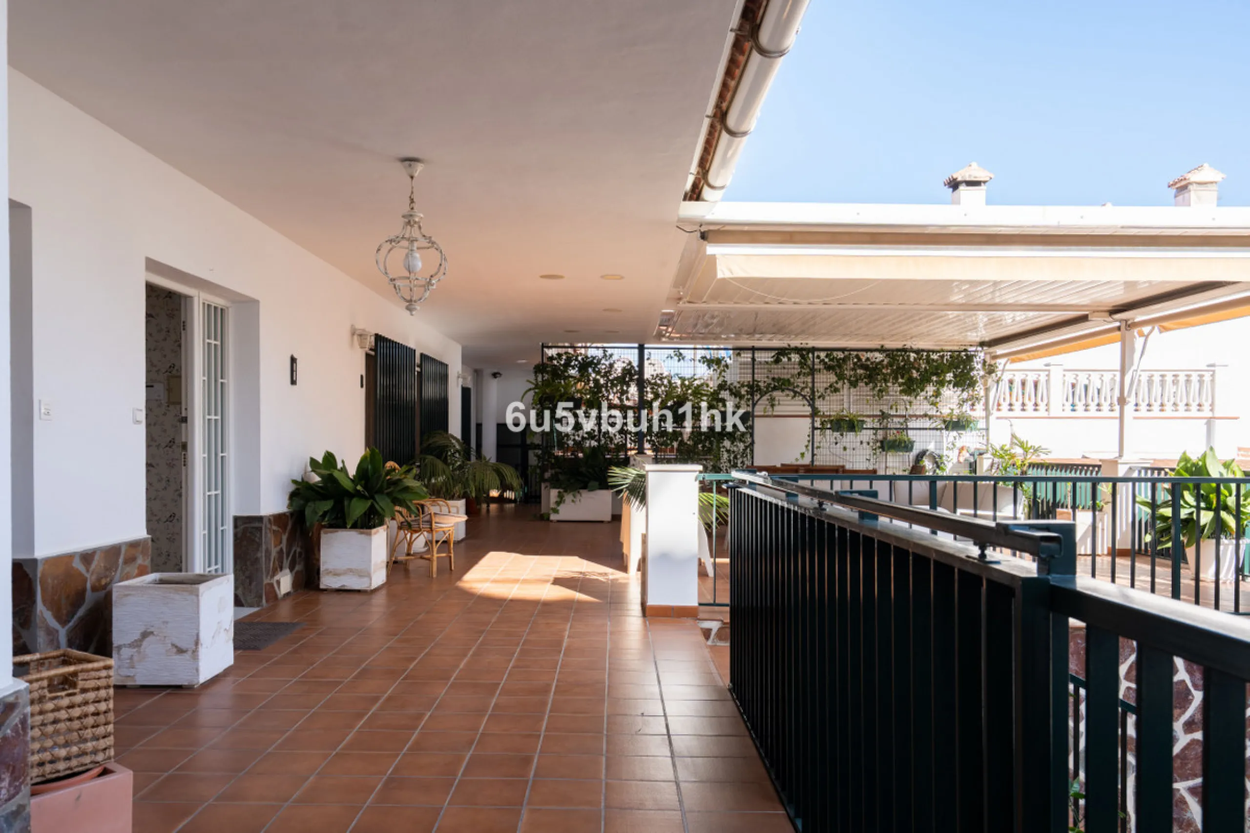 Discover a rare opportunity to own two beautifully designed homes combined on one generous plot in the heart of Vélez-Málaga — complete with private parking, a swimming pool, extensive entertainment areas, and a substantial commercial premise generating €