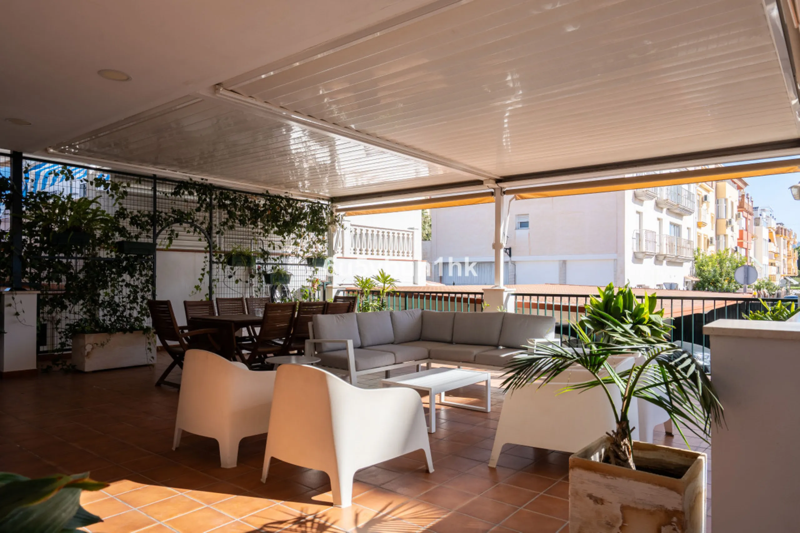 Discover a rare opportunity to own two beautifully designed homes combined on one generous plot in the heart of Vélez-Málaga — complete with private parking, a swimming pool, extensive entertainment areas, and a substantial commercial premise generating €
