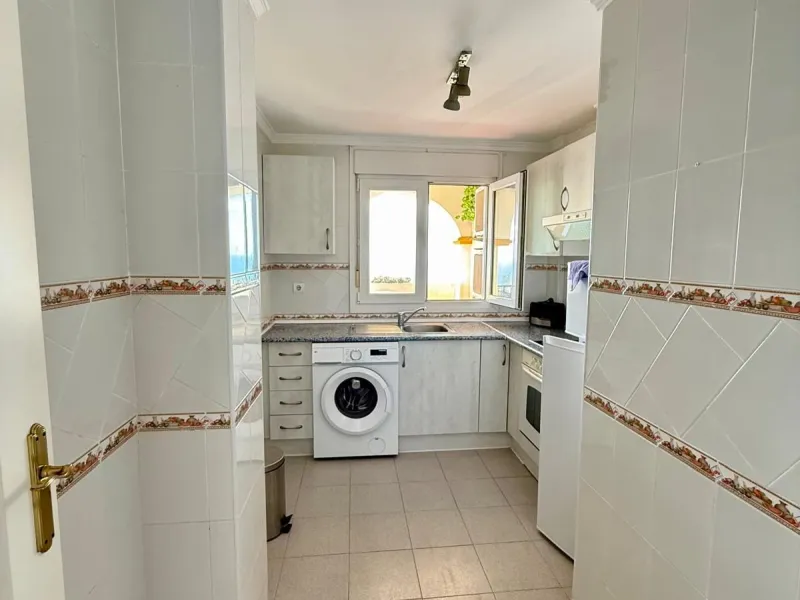 Here's a fantastic chance to own a charming two-bedroom apartment right near the beach of Carvajal.