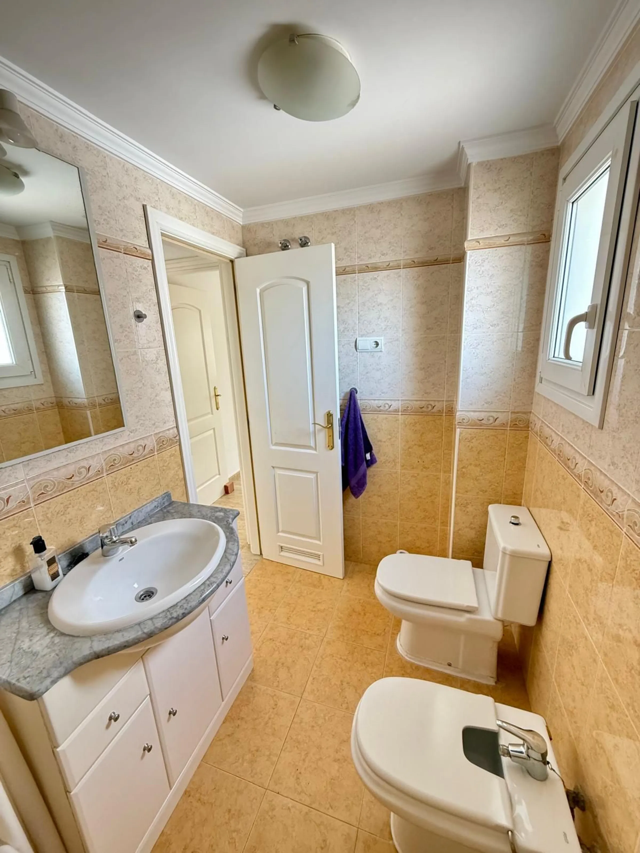 Here's a fantastic chance to own a charming two-bedroom apartment right near the beach of Carvajal.