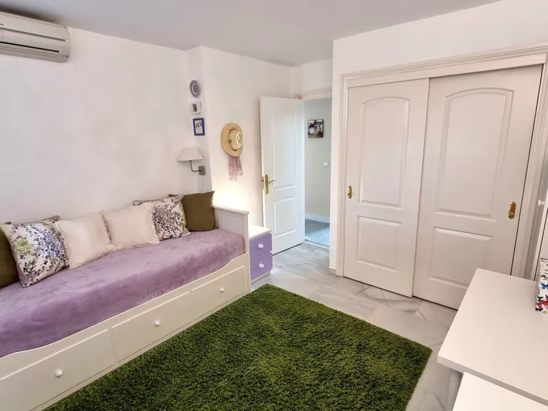 This inviting first‑floor apartment in the sought‑after El Porton community in Calahonda offers generous space, modern comfort and a wonderfully relaxed Mediterranean lifestyle. The home features two bedrooms and two bathrooms, including a main bedroom wi