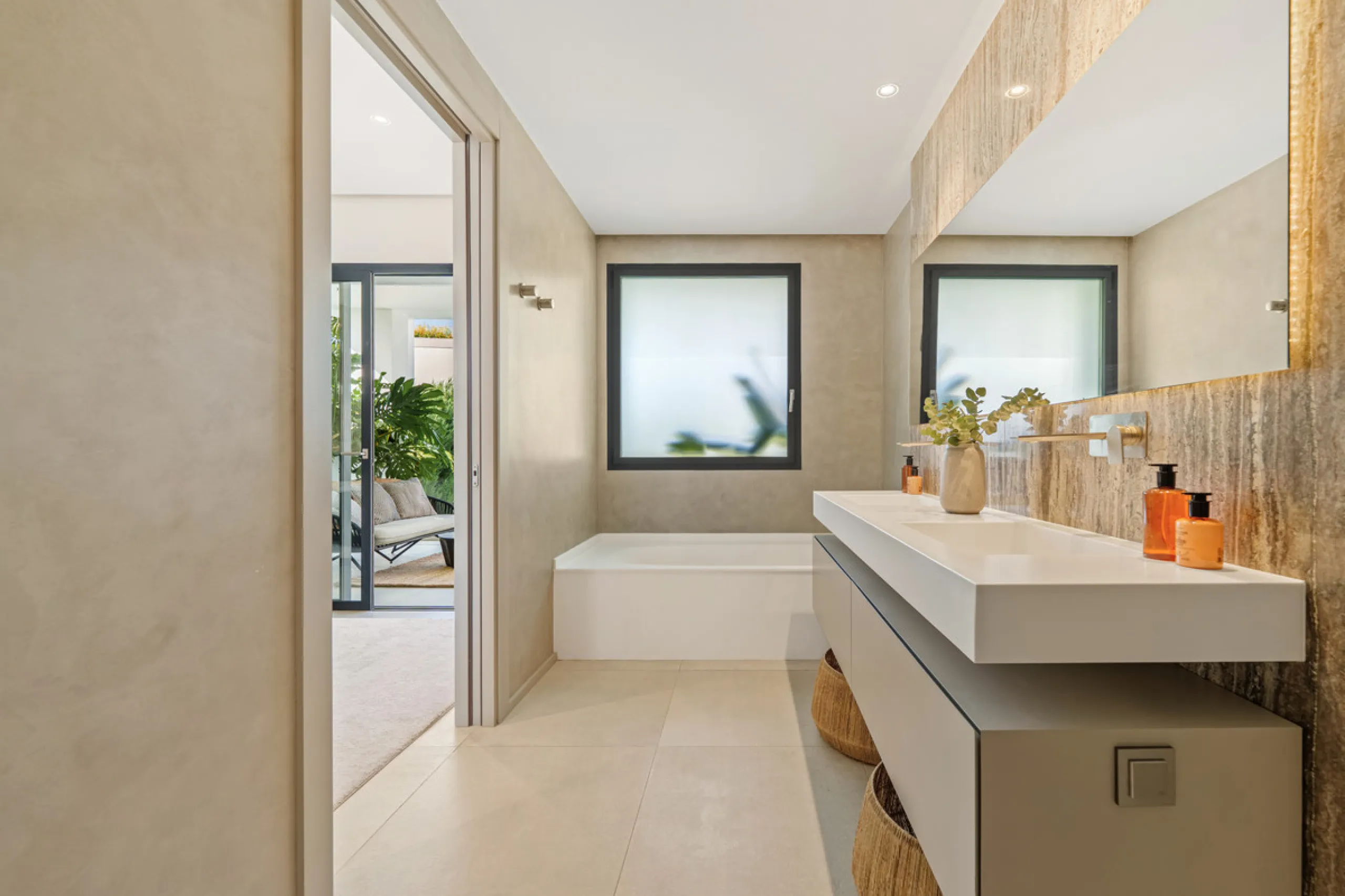 Located in the sought-after area of Nueva Andalucía, just minutes from Puerto Banús, Villa Jardin is a beautifully presented contemporary villa combining style, comfort, and functionality. The home features open-plan living areas with large sliding doors 