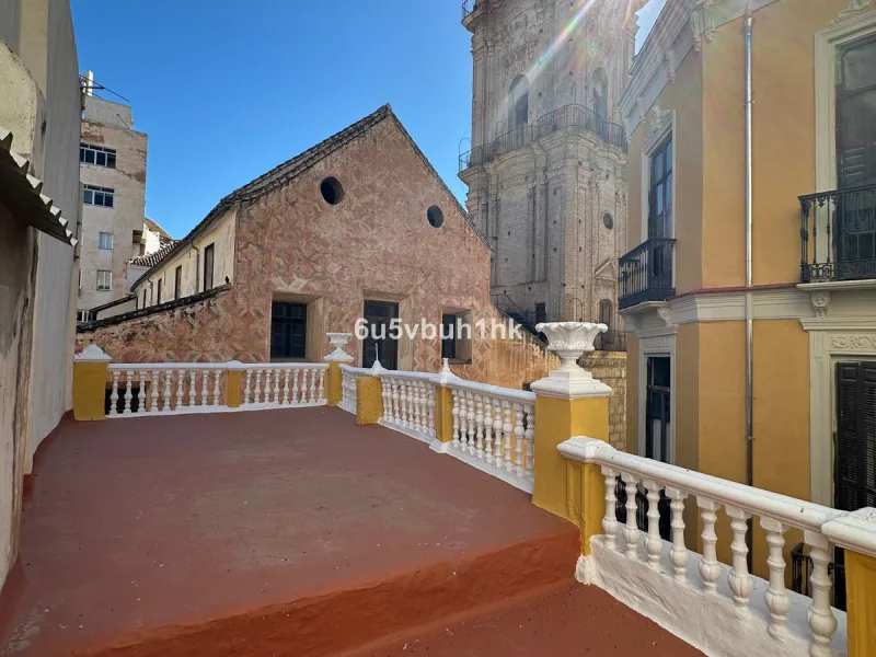 Located on one of the most picturesque streets in Málaga's historic centre, Calle San Juan, this characterful building offers a rare combination of immediate income and exceptional development potential. With its rooftop overlooking the magnificent tower 