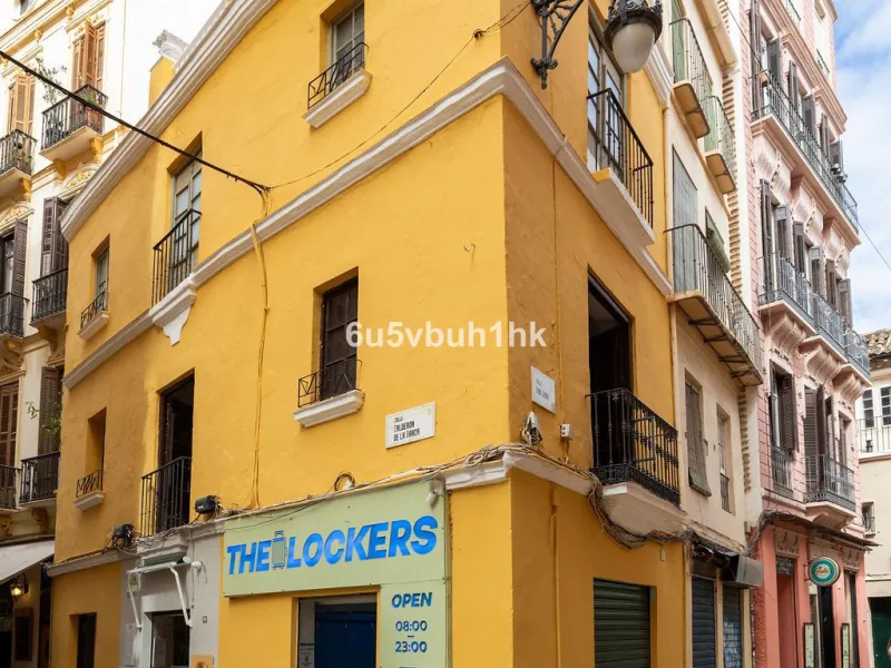 Located on one of the most picturesque streets in Málaga's historic centre, Calle San Juan, this characterful building offers a rare combination of immediate income and exceptional development potential. With its rooftop overlooking the magnificent tower 