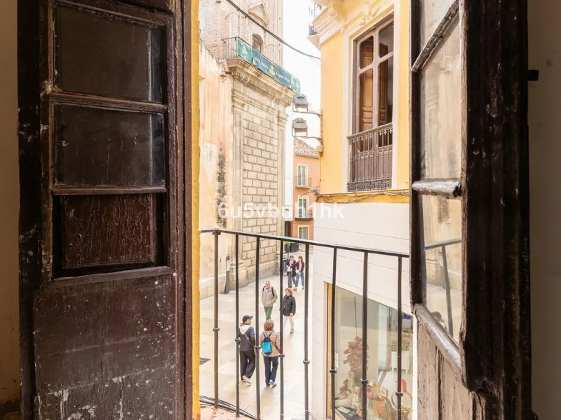 Located on one of the most picturesque streets in Málaga's historic centre, Calle San Juan, this characterful building offers a rare combination of immediate income and exceptional development potential. With its rooftop overlooking the magnificent tower 