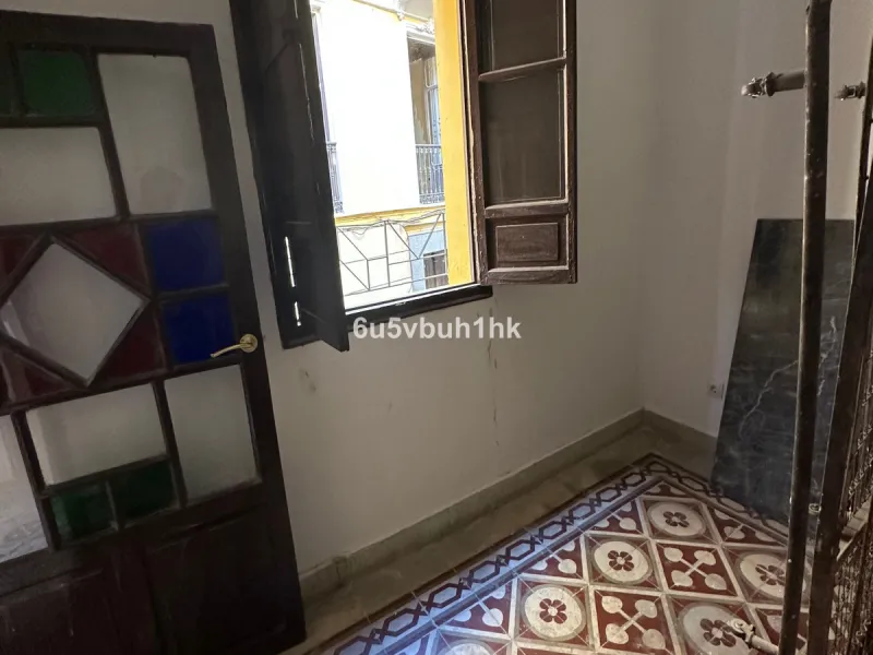 Located on one of the most picturesque streets in Málaga's historic centre, Calle San Juan, this characterful building offers a rare combination of immediate income and exceptional development potential. With its rooftop overlooking the magnificent tower 