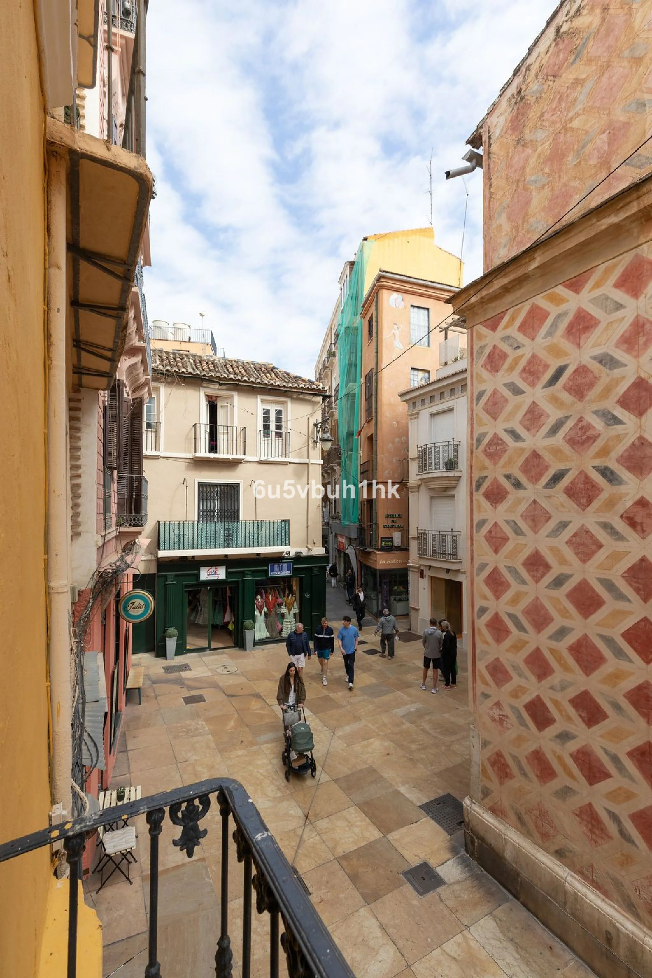 Located on one of the most picturesque streets in Málaga's historic centre, Calle San Juan, this characterful building offers a rare combination of immediate income and exceptional development potential. With its rooftop overlooking the magnificent tower 