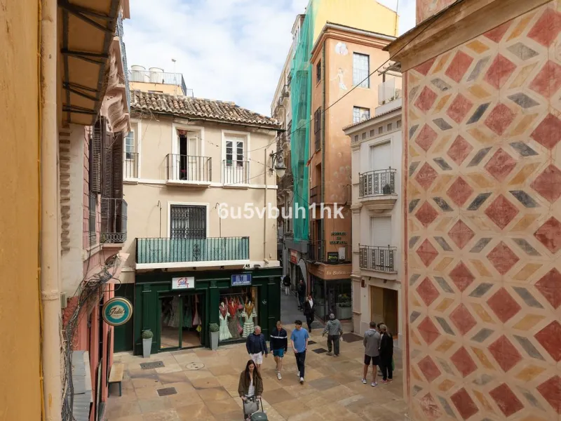 Located on one of the most picturesque streets in Málaga's historic centre, Calle San Juan, this characterful building offers a rare combination of immediate income and exceptional development potential. With its rooftop overlooking the magnificent tower 
