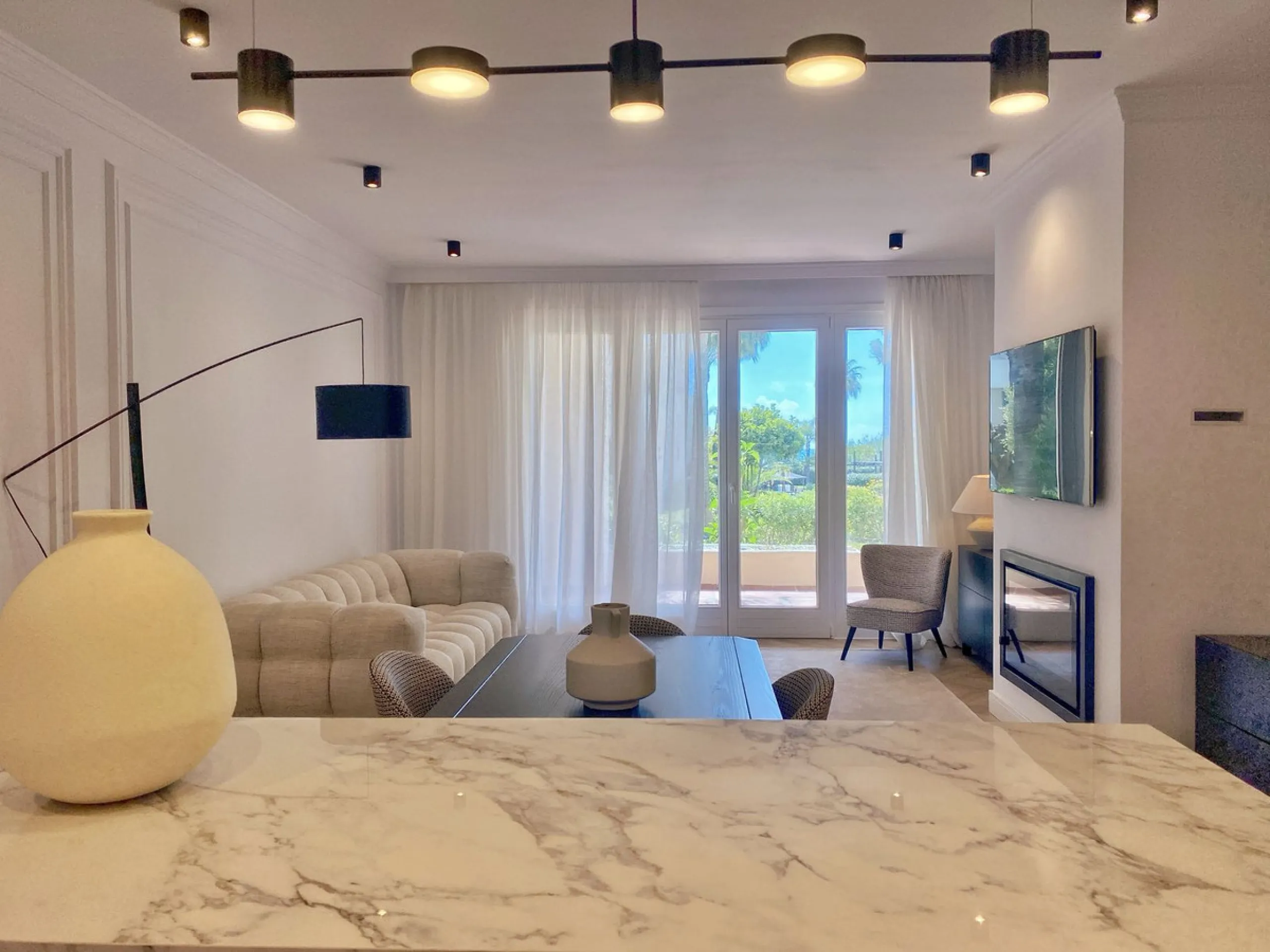 This gorgeous apartment is located in the upmarket urbanisation Bahia del Velerin - frontline beach, right on the beautiful paseo maritimo, meters away from the sea; with 24/7 security, underground parking, storage room, beautiful garden and swimming pool