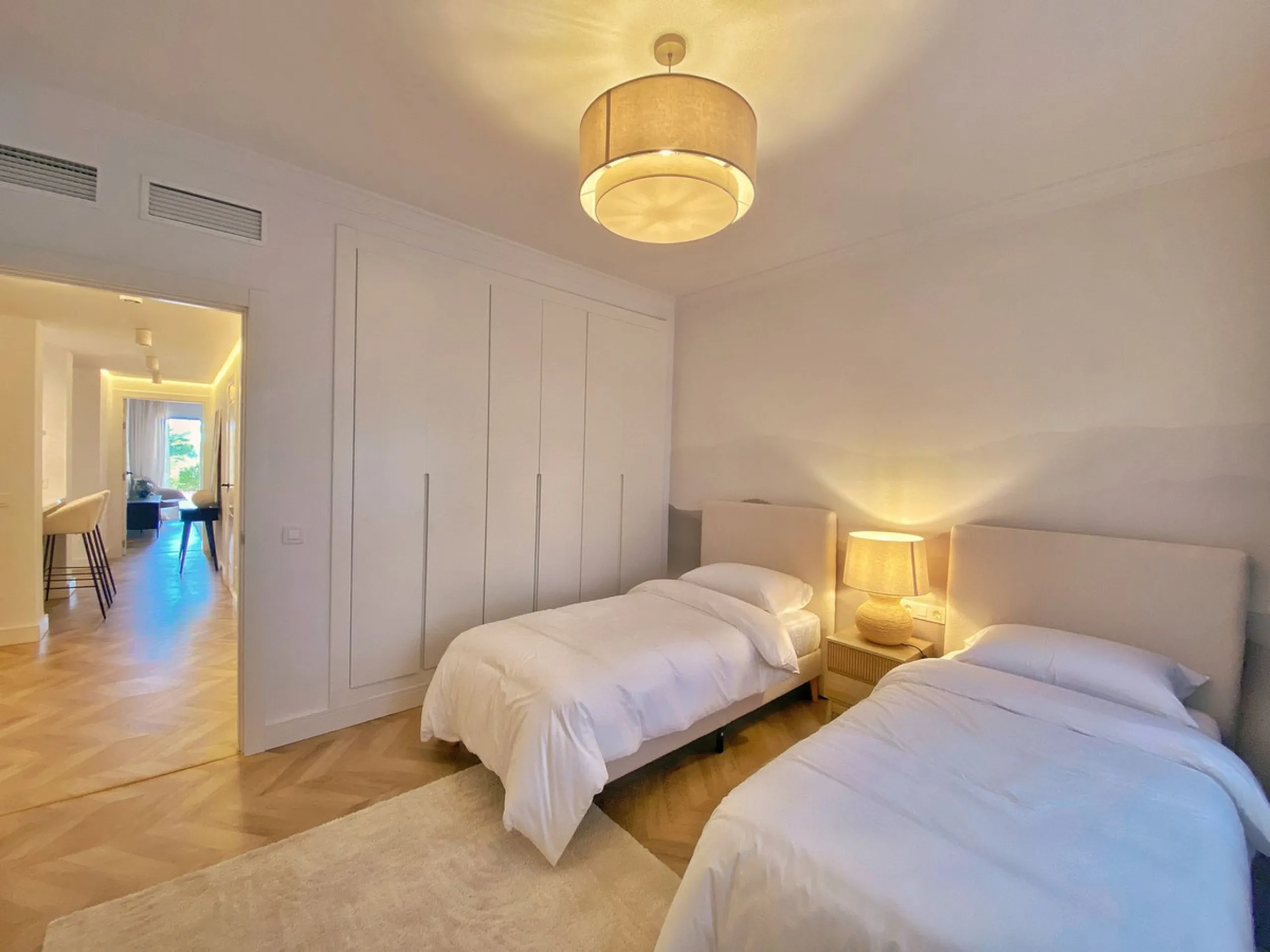 This gorgeous apartment is located in the upmarket urbanisation Bahia del Velerin - frontline beach, right on the beautiful paseo maritimo, meters away from the sea; with 24/7 security, underground parking, storage room, beautiful garden and swimming pool