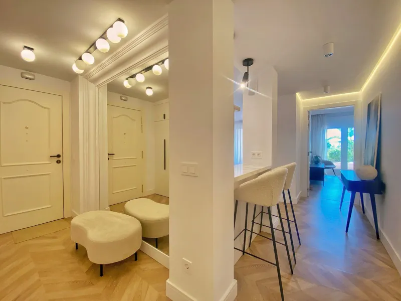 This gorgeous apartment is located in the upmarket urbanisation Bahia del Velerin - frontline beach, right on the beautiful paseo maritimo, meters away from the sea; with 24/7 security, underground parking, storage room, beautiful garden and swimming pool
