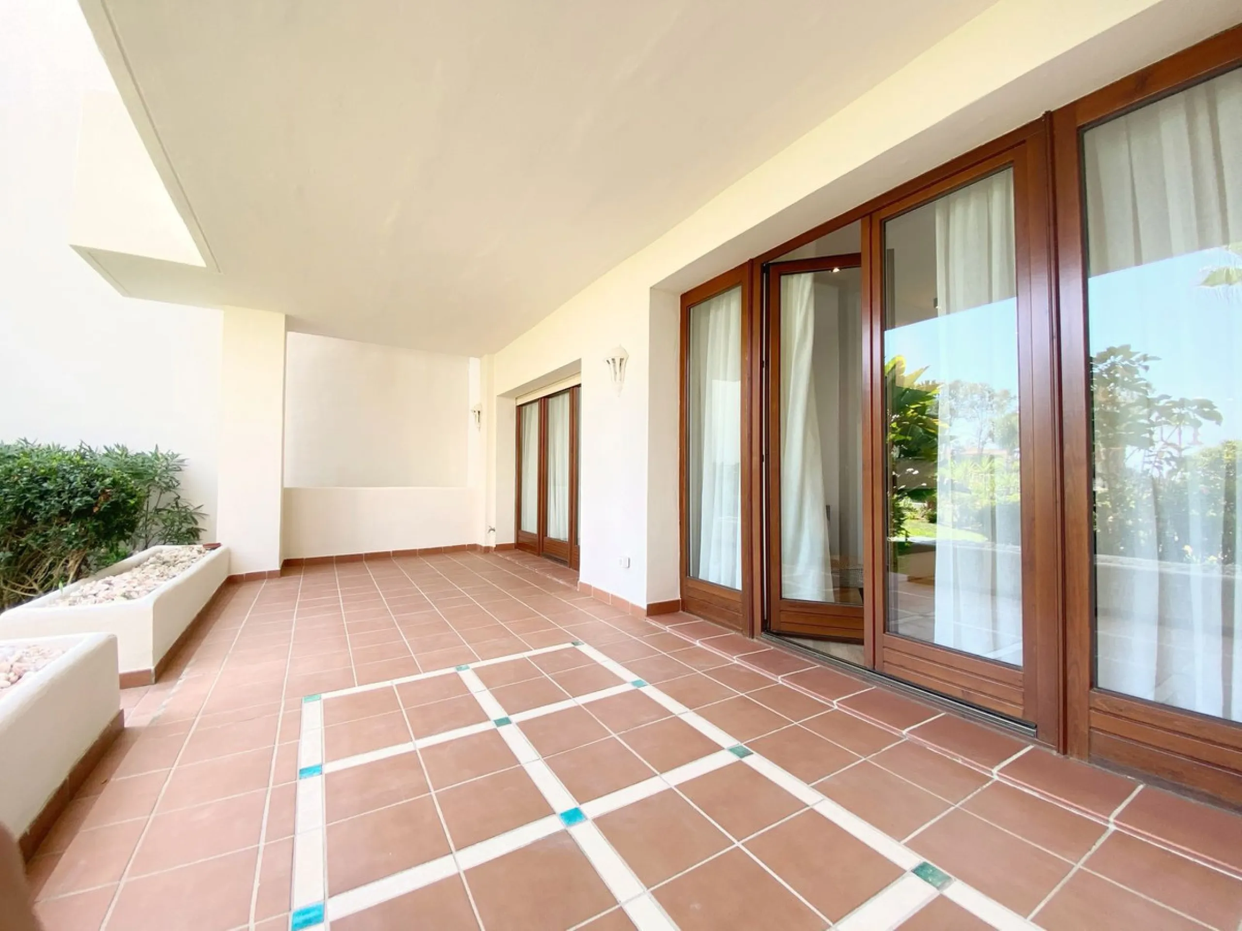 This gorgeous apartment is located in the upmarket urbanisation Bahia del Velerin - frontline beach, right on the beautiful paseo maritimo, meters away from the sea; with 24/7 security, underground parking, storage room, beautiful garden and swimming pool