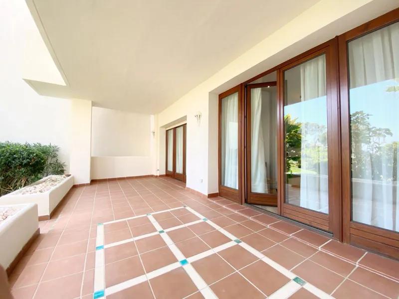 This gorgeous apartment is located in the upmarket urbanisation Bahia del Velerin - frontline beach, right on the beautiful paseo maritimo, meters away from the sea; with 24/7 security, underground parking, storage room, beautiful garden and swimming pool