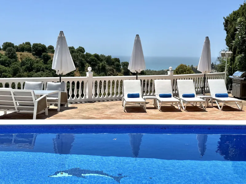 New Listing - Lovely 5 bed, 3.5 bath Villa on elevated plot in Upper Calahonda, offering beautiful panoramic views over tree-lined hillside down to the sea.