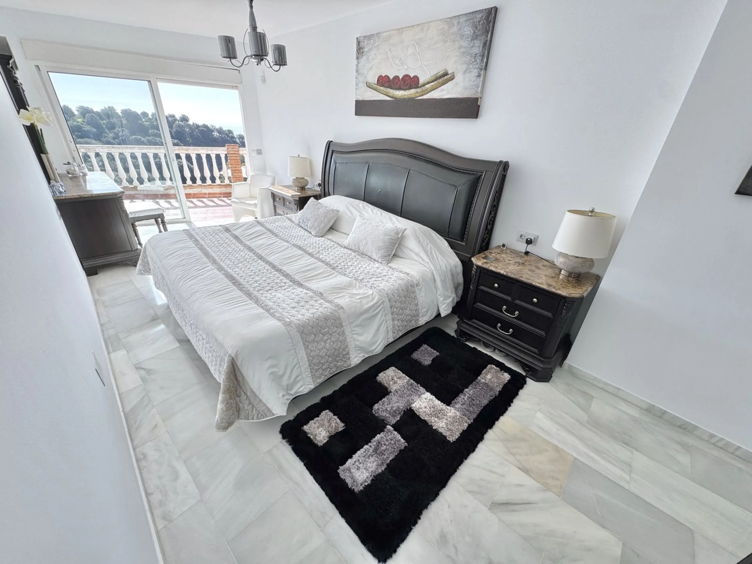 New Listing - Lovely 5 bed, 3.5 bath Villa on elevated plot in Upper Calahonda, offering beautiful panoramic views over tree-lined hillside down to the sea.