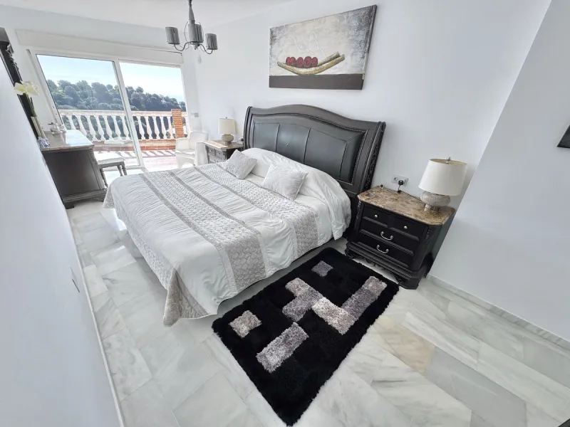 New Listing - Lovely 5 bed, 3.5 bath Villa on elevated plot in Upper Calahonda, offering beautiful panoramic views over tree-lined hillside down to the sea.