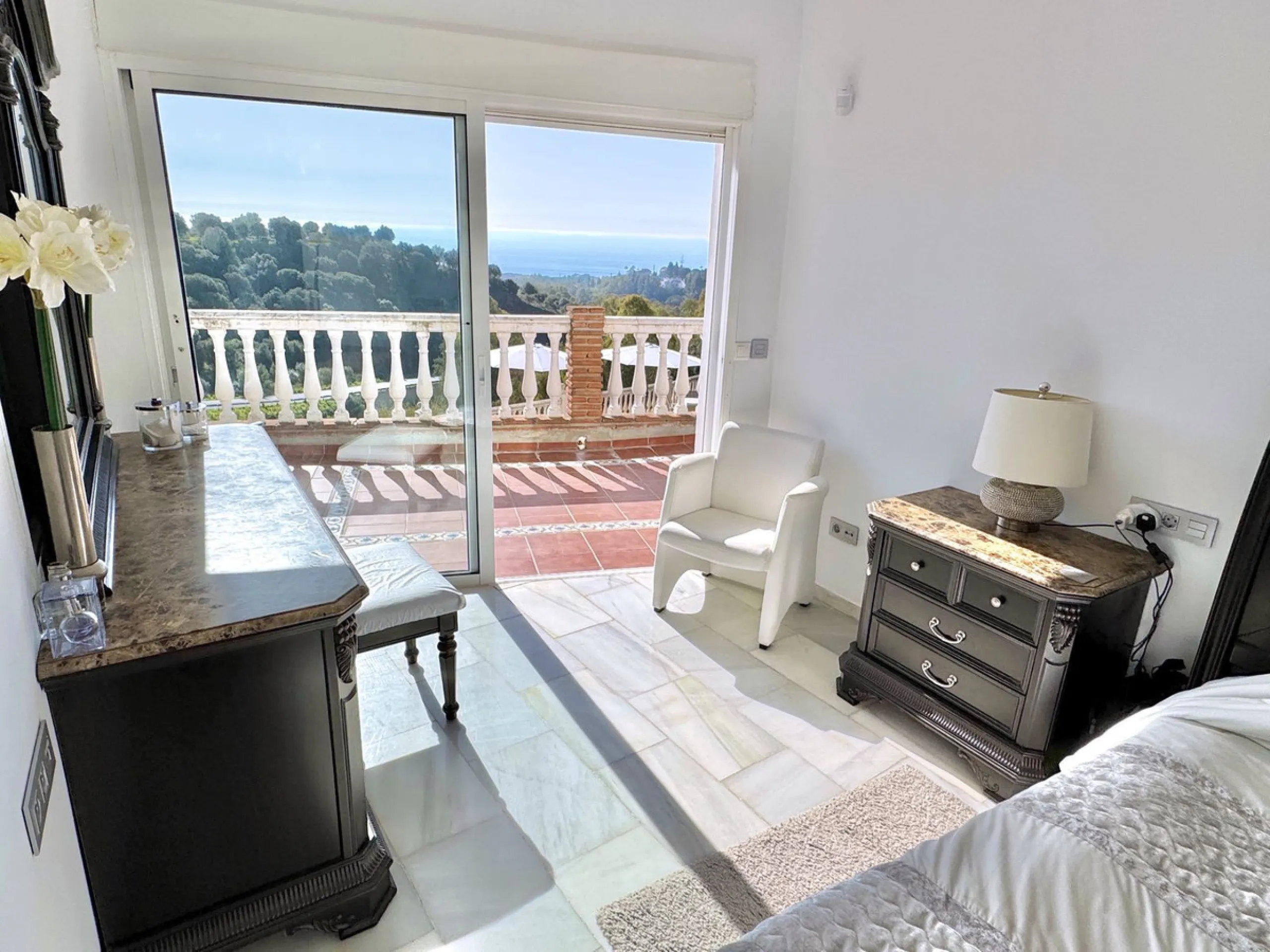 New Listing - Lovely 5 bed, 3.5 bath Villa on elevated plot in Upper Calahonda, offering beautiful panoramic views over tree-lined hillside down to the sea.
