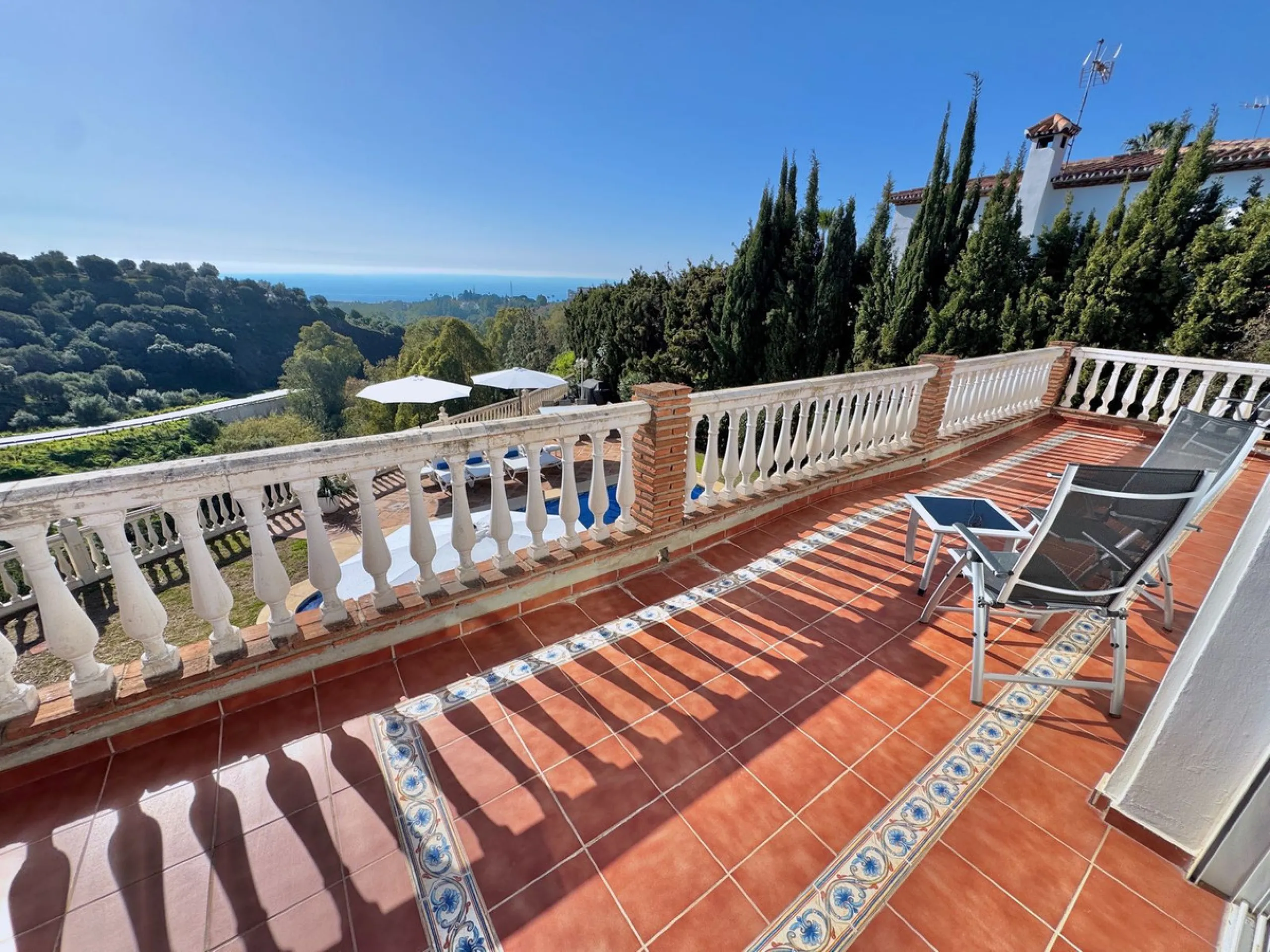 New Listing - Lovely 5 bed, 3.5 bath Villa on elevated plot in Upper Calahonda, offering beautiful panoramic views over tree-lined hillside down to the sea.